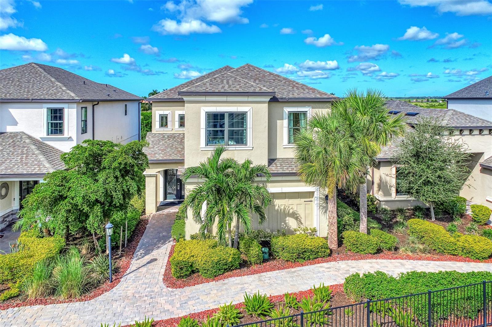 Welcome to an extraordinary opportunity to own a magnificent model home located in the exclusive Skye Ranch community of Sarasota, FL. This stunning residence spans an impressive 3,207 square feet and boasts a thoughtfully designed layout featuring four generously sized bedrooms and two and a half elegant bathrooms. Every corner of this home is adorned with exquisite high-end finishes, epitomizing luxury and sophistication.
Upon entering, you are greeted by a gourmet kitchen that serves as the heart of the home. It is equipped with sleek quartz countertops and a striking glass backsplash that adds a touch of modern elegance. The kitchen's functional design is perfect for both everyday cooking and hosting lavish dinner parties. Complementing this space is the meticulously planned lighting scheme, which includes recessed lights that enhance the ambiance and highlight the architectural details, such as the beautifully crafted wood crown molding found throughout the home.
The open-concept layout seamlessly connects the indoor and outdoor living spaces, creating an ideal environment for entertaining guests or enjoying tranquil family moments. Step outside into a personal oasis where a private pool awaits, surrounded by a screened lanai that offers shade and comfort. Adjacent to the pool, a charming brick fire pit area provides a perfect setting for cozy gatherings under the starlit Florida sky.
Adding to the home's convenience is an attached garage, providing ample storage and protection for vehicles, as well as laundry facilities that enhance daily living. The Skye Ranch community itself offers a wealth of amenities, ensuring a lifestyle of comfort and leisure. Residents have access to a state-of-the-art fitness gym, beautifully landscaped common outdoor spaces, a well-equipped playground, tennis courts, and a community pool, providing endless opportunities for recreation and relaxation.
The home is equipped with impact glass windows and doors, providing peace of mind with enhanced security and energy efficiency. Strategically located, this property offers easy access to I-75, making travel convenient, and places you within proximity to the stunning Siesta Key Beach, renowned for its pristine sands and clear waters. An array of shopping and dining options are also nearby, allowing for an enriched lifestyle filled with convenience and choice.
This exceptional home is more than just a place to live; it is an invitation to experience unparalleled luxury and comfort. Don’t let this opportunity pass you by. Schedule a showing today and step into a world of elegance and distinction.