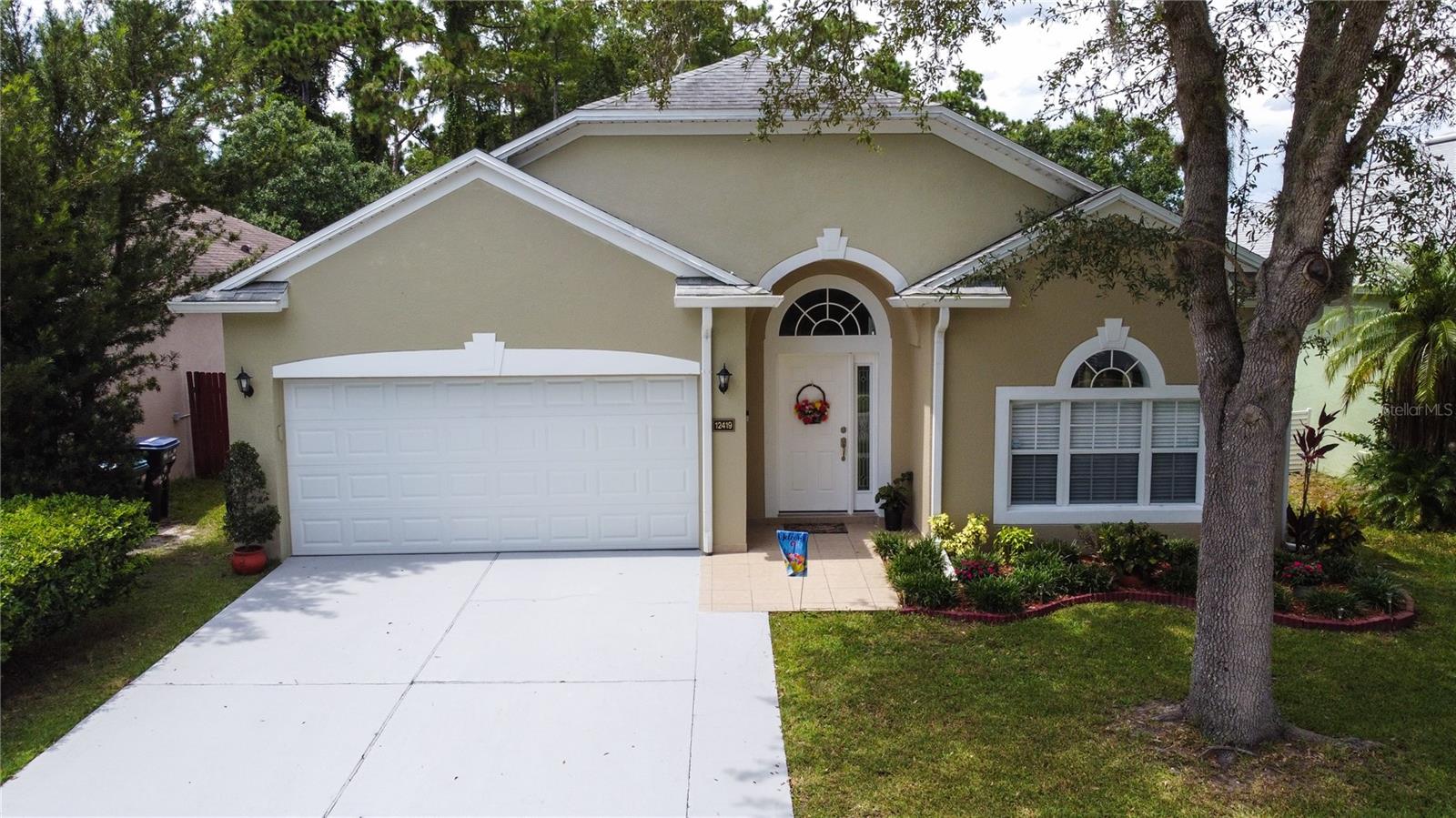 It's a spacious and well-maintained 4-bedroom, 2-bathroom home located in a prime area, offering a blend of comfort and convenience that I think you'll appreciate. This charming home features tile flooring throughout, creating a clean and contemporary ambiance. The heart of the home, the kitchen, is quite spacious and features solid wood cabinets complemented by elegant granite countertops, making it a perfect space for cooking and entertaining. Adding to its appeal, the roof was replaced in 2018, and the AC unit in 2022, which is diligently maintained every six months, ensuring comfort and peace of mind. The home also offers wheelchair accessibility for added convenience. One of the significant advantages of this location is its excellent access to major highways, with both the 408 and 417 just minutes away, making commutes and travel incredibly easy. The fully fenced backyard offers a private oasis, perfect for barbecues and outdoor entertaining, and features mature mango, avocado, and lemon trees. Furthermore, the home is situated near Waterford Lakes Town Center, ensuring that you're just a stone's throw away from a wide array of shopping, dining, and entertainment options. The community itself also provides fantastic amenities for residents, including a refreshing swimming pool, a volleyball court, and multiple playgrounds, adding even more value and enjoyment to living here.