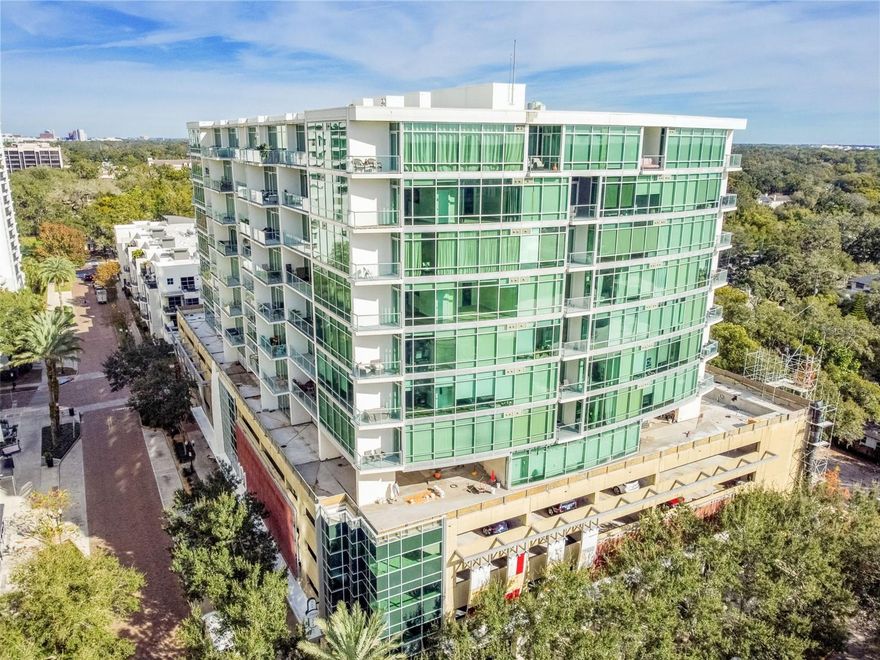 Stunning 8th floor condo in the luxury 101 Eola high rise! This freshly painted one bedroom unit features a sectioned bedroom, full bathroom with walk-in closet, gorgeous kitchen and living area with floor to ceiling windows. The kitchen boasts beautiful cherry cabinetry, granite countertops, stainless steel appliances and a breakfast bar. Relax on the balcony and enjoy the panoramic view of other downtown neighborhoods and skyline. This unit includes a washer/dryer and two assigned parking spaces . The building provides outstanding amenities such as a community pool, spa, sauna, clubhouse, rec room, fitness center, guest lobby and a 24-hour concierge! You can't beat this downtown location near Lake Eola, restaurants, shopping and entertainment!