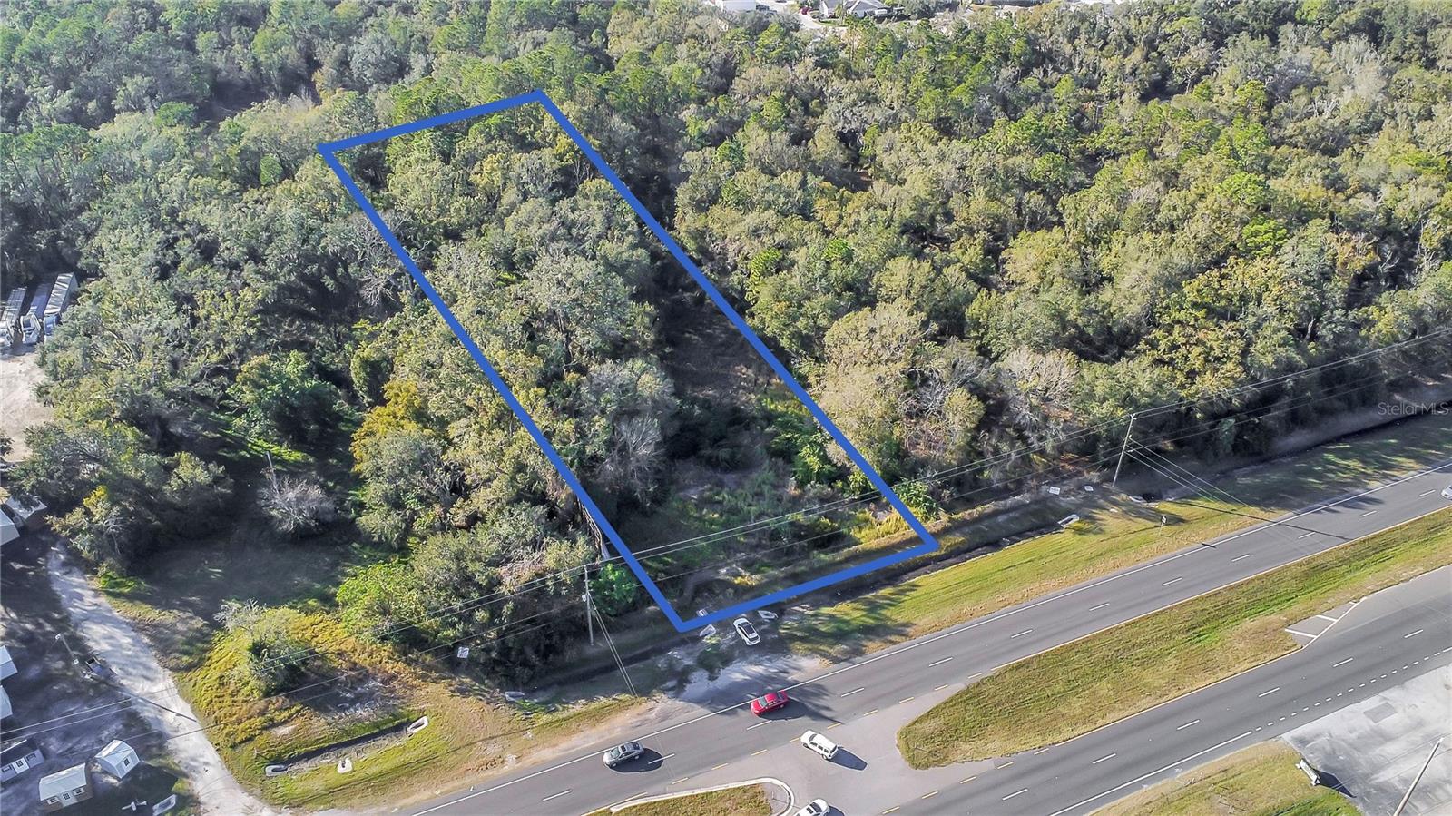 Unlock your investment potential with this expansive 2.2605-acre parcel of land, perfectly situated in a prime location. Zoned for COMMERCIAL/INDUSTRIAL LCC (Linear Commercial Corridor), this property offers incredible flexibility for various business ventures. It features a billboard for maximum visibility and is easily accessible, with a traffic light on the opposite street allowing for convenient access without the need for U-turns. Located just minutes away from several planned communities and I-4, this site ensures a steady flow of potential customers. Don’t miss out on this exceptional opportunity in a rapidly growing area—secure your future today!