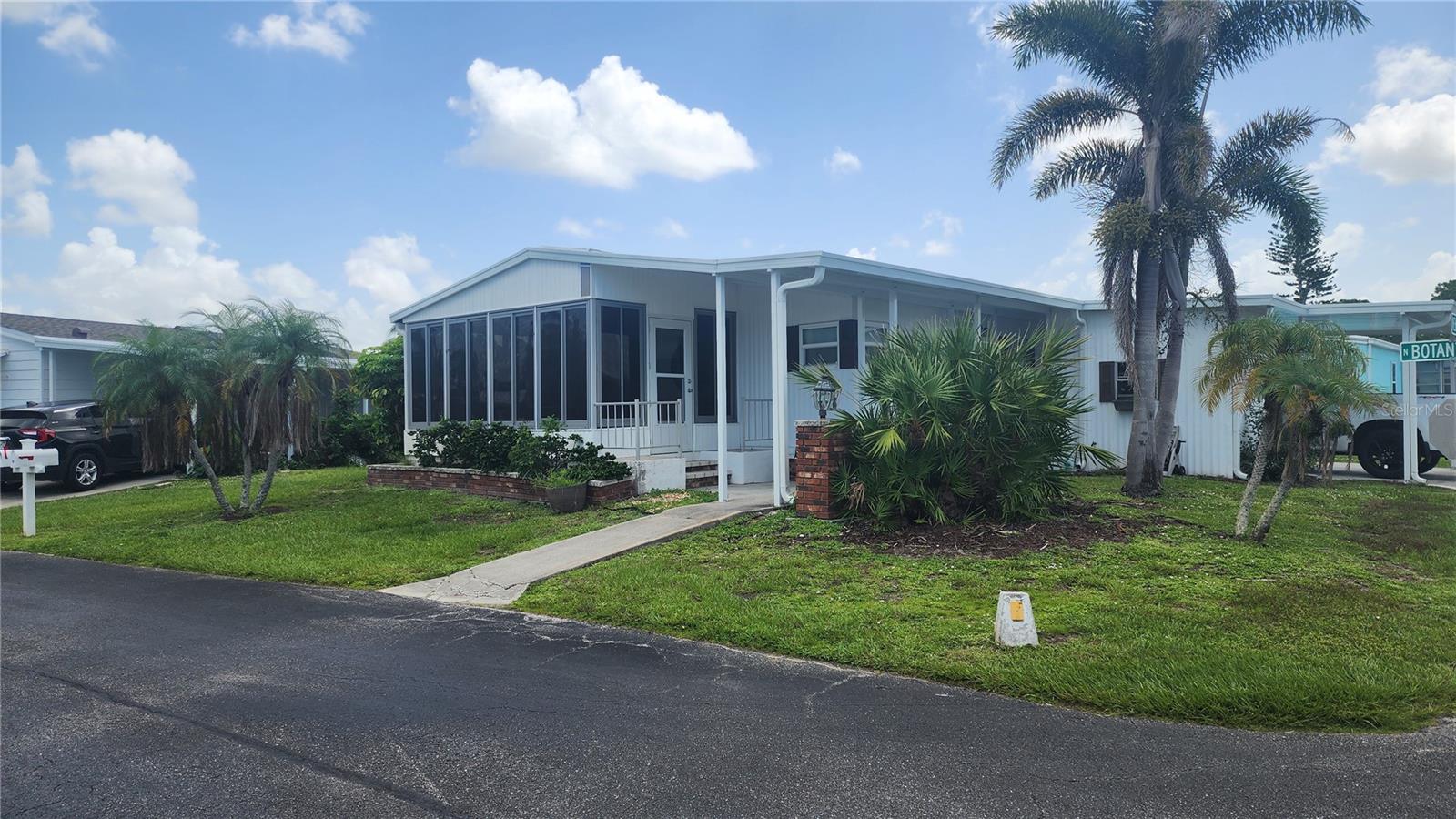 Furnished and Turnkey ~ pride of ownership shows in this well maintained home located on a corner lot in the sought after Polynesian Village! Loads of beautifully done updates including updated kitchen, vaulted ceilings, new french patio door with built in blind, bathrooms have been nicely updated, AC Oct 2021, metal Roof 2014, newer vinyl windows, siding painted, ceramic tile throughout main living areas and lanai with plywood subflooring installed under flooring, new carport and new shed for storage and washer and dryer. There are lots of sun-filled spaces to enjoy including the front Florida room with tile flooring, vaulted ceiling and lots of windows. Discover Florida Living at its Finest at Polynesian Village Community that offers amenities such as a pool, shuffleboard courts, and a clubhouse hosting numerous activities. The hoa fee covers basic cable, fiber-optic internet, lawn mowing and upkeep of the association amenities. There is also a storage yard with spaces for rent at a low $130/year. Don't miss out on this incredible opportunity and rare find! Schedule your private showing today! Truly a Must See!