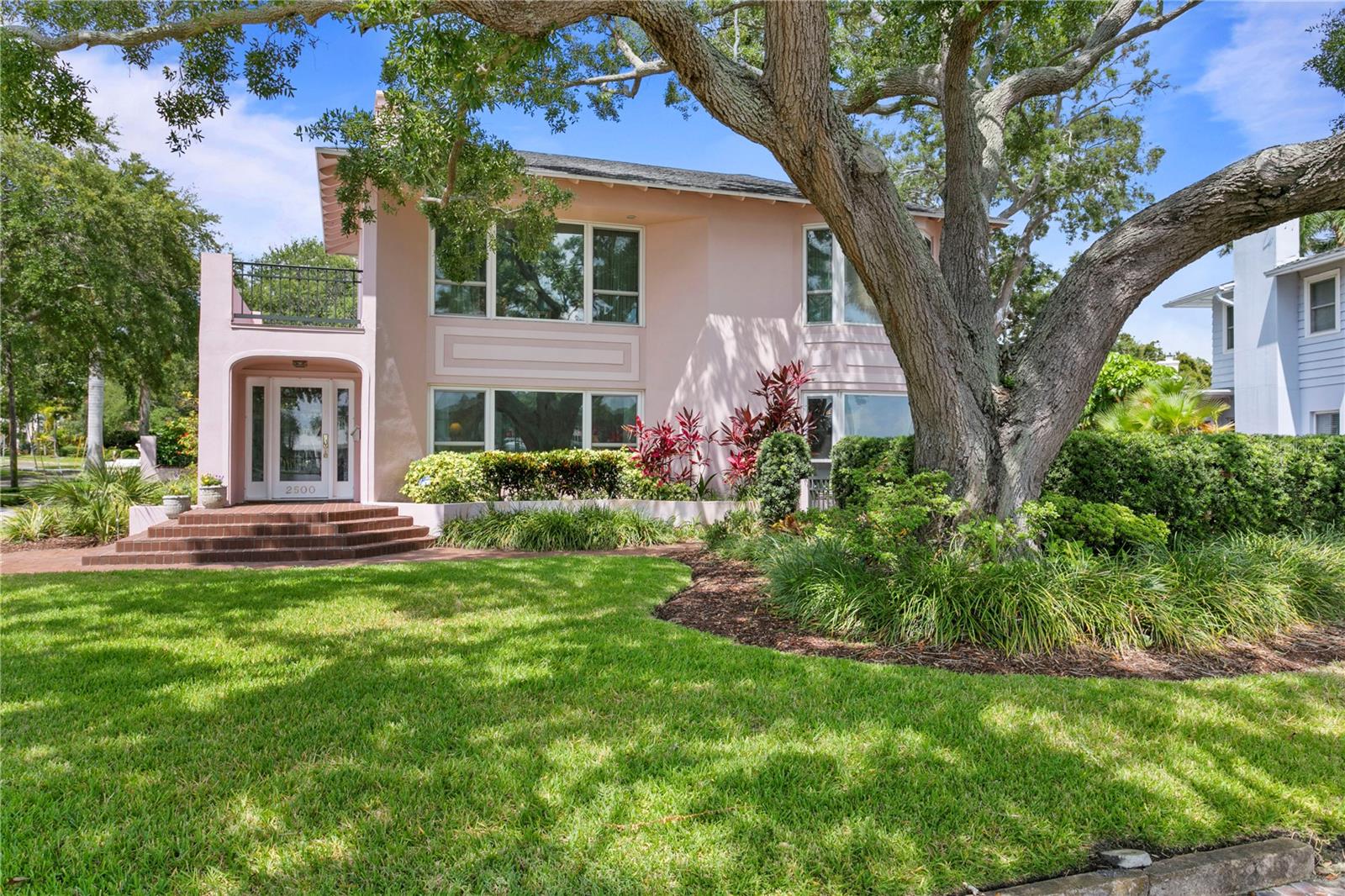 Rare opportunity to own prime real estate off of Coffee Pot Blvd in the coveted Granda Terrace Historical District of the Old Northeast! Situated on a beautifully landscaped corner lot, this 2-story block home features 4 bedrooms PLUS a loft which could be used as a den or office, 3 bathrooms, nearly 4300 SFT, formal dining room, fireplace, 1-car garage with alley access, separate casita with full bathroom, pebble tec pool, TWO highly desirable WATER LOTS, and so much more! As you approach the front of the home, you are greeted by a majestic oak tree and lovely curb appeal. Upon entering, there is a charming sun room perfect for relaxing with lots of natural light. Original hardwood floors throughout most of the home, the main floor offers 3 spacious bedrooms, 2 full bathrooms (one of which is a Jack and Jill), formal dining room, galley style kitchen with all wood cabinetry / granite countertops / built-in pantry, and an expansive laundry room that could also be used as a craft room. The second floor offers a bonus loft space that would be perfect for an office. It also features the spacious master retreat with a large walk in closet and en suite bathroom - again magnificent views of the waterfront! In fact, many of the rooms in the front of this home offer a stunning view! Step outside into your backyard oasis showcasing a travertine deck area and a pebble tec pool - perfect space for entertaining family and friends! An added bonus is the casita that would be an ideal guest suite which features a studio and full bathroom. Enjoy a nice cup of coffee or glass of wine in the courtyard overlooking breathtaking views of Coffee Pot Bayou. Better yet, walk across the street to your TWO water lots with private dock and watch all the various marine life that passes by! Conveniently located to vibrant Downtown St. Petersburg, shops, dining, museums, St. Pete Pier, Renaissance Vinoy Resort, and so much more. Easy access to I275, Tampa, and our beautiful sandy Gulf Beaches. Such a niche property with so much potential! Call today to schedule your private showing!