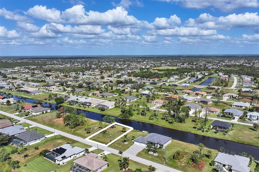 Build the home of your dreams on this terrific waterfront home site, with plenty of builders to choose from and a quiet neighborhood to reside in. Go golfing at one of the 5 Premier Community Golf Courses, spend the day at a local beach or just relax at home. Shopping, golfing, live entertainment, boat ramps, and local Gulf beaches are all just minutes away. Enjoy waterfront dining and beach relaxation close by at Boca Grande and Manasota Key. When it’s time to come home, relax in the quiet retreat you designed just for yourself! Don’t let this chance pass you by, call today to turn your dreams into a reality! Want a double lot? The adjacent lot (53 Tournament Road) is also for sale.