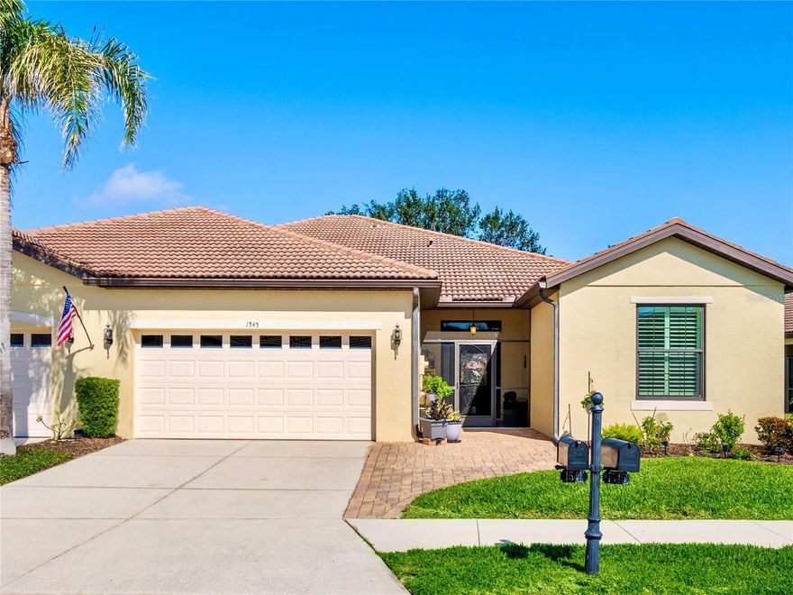 This beautifully upgraded Giovanni paired-villa in the premier 55+ community of Venetian Falls, is just minutes from sunny beaches, shopping, dining, and Venice’s historic district. This home offers both comfort and peace of mind with so many high-end features. HURRICANE-RATED, iNSULATED ENERGY STAR IMPACT WINDOWS, 20” PORCELAIN TILE and WOOD LAMINATE floors, a SCREENED AND TILED FRONT ENTRY, and an EXTENDED LANAI create a perfect blend of elegance and functionality. The BEVELED-GLASS FRONT DOOR welcomes you with abundant natural light. High 9’ ceilings with CROWN MOLDING, PLANTATION SHUTTERS, ENHANCED BASEBOARDS, SOLAR TUBES in the living room and primary bathroom, FRENCH DOORS to the DEN for added privacy, an elegant TRAY CEILING in the living room, and a CENTRAL VACUUM system elevate the home’s appeal. The kitchen is both stylish and functional, featuring durable QUARTZ COUNTERTOPS, MAPLE-FINISH CABINETRY with trim and under-cabinet lighting, a WALK-IN PANTRY, and GE Profile stainless steel appliances, including a CONVECTION oven with an INDUCTION cooktop. A charming DINETTE, surrounded by windows, provides a bright and inviting space to enjoy your morning coffee with a view. The open, split floor plan provides flexibility in arranging the common areas to suit your preferences. Additional highlights include an EXPANDED PAVER WALKWAY, IN-WALL PEST CONTROL, LEAF GUARD GUTTER SYSTEM, and lush landscaping. For storm protection, easy-to-install HURRICANE STORM SHIELDS are included for the front entry and lanai, plus a REINFORCED GARAGE DOOR. Step outside to your private outdoor living area, perfect for grilling, dining, and relaxing while taking in serene lake views and the frequent visits from herons and other birds. Venetian Falls offers outstanding amenities, including a resort-style clubhouse with a heated lap pool and spa, a resistance-walking pool, a state-of-the-art fitness center, a billiard room, bocce courts, a full-time activity director, and on-site management. The reasonable HOA fee covers lawn maintenance, irrigation, roof pressure washing, exterior painting, and basic cable TV and internet. Don’t miss this opportunity to enjoy resort-style living in this beautiful home!