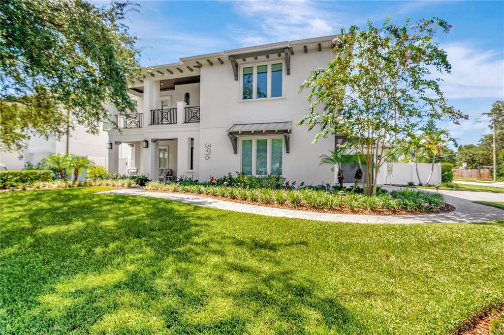 Brand new in Fall of 2020, this 5 bed 5.5 bath Platinum property by Adobe Homes is loaded with extras and upgrades. Located on a coveted .25 acre corner lot in Swann Estates, this home offers 3 car garage, elevator, high end window coverings, luxurious outdoor living space with upgraded landscaping, lighting, and more. Entering this beautiful home, on your left is an office or den with hidden storage. The spacious open floor plan boasts a wine display, 10 ft. ceilings, and smooth finish walls. The dream gourmet kitchen includes Wolf and Subzero appliances, and storage galore with a full walk-in pantry. Additionally, adjacent to the kitchen, a butler's pantry features a wet bar, Subzero wine fridge and ice maker. Walk through the beautiful 16ft pocket sliding glass doors into an outdoor paradise! Your outdoor kitchen is equipped with a sink, a BBQ, and a refrigerator to keep your beverages cold when you step into the solar and gas heated pool and jacuzzi. A lush tropical landscape surrounds the backyard where you will find a 1250 sqft Tour Greens custom putting and chipping area. Re-entering the home through the adjacent pool bathroom, the lower level also features a bedroom with en-suite bath. Take the stairs or elevator to the second level, where first you'll find a wet bar and Marvel beverage center adjacent to the bonus room. The spacious upstairs owner's suite features power Silhouette blinds, massive walk-in closet, two vanities, and a wet room with rainshower and soaker tub. Three more en-suite bedrooms are also right around the corner. A spacious outdoor private balcony with giant oaks serves two of the bedrooms. Among other features, you will find upgraded technology including Lutron automated lighting, Wi-Fi thermostats, full security and camera system and Sonos sound. Enjoy huge energy savings with a recirculating tankless water heater, impact windows, icynene insulation and a FULL NET ZERO SOLAR SYSTEM with electric car garage plug-in, installed in 2022. Grady, Coleman, Plant school district, and close to Trader Joes, Publix, and more. Hurry, don't wait to schedule a showing today!