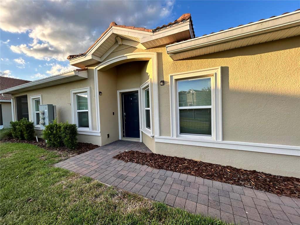 Photo of 1159 Trappers Trail Loop, Davenport, FL 33896 (MLS # O6426263)