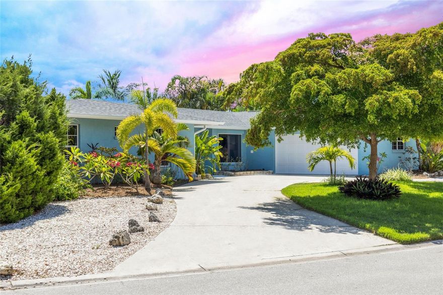 Welcome to your personal island paradise on Siesta Key! This stunning 4-bedroom, 2.5-bath home with a 2-car garage and office is the epitome of beach and boating bliss. Just a short walk from the world-renowned Siesta Key Beach, famous for its powdery white quartz sand and dazzling azure waters, this 2,527 square-foot gem sits on the grand canal, offering deep boating water and a front-row seat to spectacular, colorful sunsets every evening. 

Step inside to an open, light-filled floor plan that has been lovingly expanded and renovated. A new 2024 roof new gutters, 2021 & 2017 HVACs, a new second 200-amp electrical panel, a new 100-amp sub-panel, 50-amp EV charging outlet, new tankless water heater, new pool pump & heater, hurricane impact sliders, with plumbing hydrojetted, descaled & lined in 2023, provides peace of mind & affordable insurance for decades to come. The entire interior has been freshly painted, including the trim and ceilings, with new door hardware and modern touches. The bamboo floors in the bedrooms have been refinished, creating a warm & inviting atmosphere throughout.

The heart of this home is the gourmet kitchen, a masterpiece of high-end design and functionality. Custom-built cabinetry with a sleek melamine finish, including a coffee station and appliance garage, all feature push-to-open mechanisms. The floating butcher block table adds a touch of charm, complemented by custom pendant lights and a ceiling flush mount light fixture in the kitchen nook. The kitchen is adorned with hand-crafted Moroccan tile and boasts top-of-the-line appliances: an Ilve Majestic II induction 36-inch range with an external venting hood, a Liebherr built-in panel-ready fridge and freezer, a Miele built-in panel-ready dishwasher, a Summit Combination Dual Zone Wine Cellar, a Moen smart touchless faucet, and a Ruvati stainless steel sink with new garbage disposal. Even the bougiest of chefs would approve!

The great room and dining area flow effortlessly to the expansive outdoor entertaining space. The dining room, featuring a striking wood ceiling and sliding glass doors, opens to a lush, tropical backyard. Here, you can relax by the pool, catch some rays, or dine alfresco under the stars on the trellised patio. An extensive landscaping rebuild has transformed the yard into a tropical oasis.

The owner's suite is a serene retreat with a custom wood ceiling, bamboo floors, and a large master bath featuring a separate shower, jetted tub, and new Toto toilet. French doors open to a versatile space that can serve as a den, office, or fifth bedroom. The guest wing includes three large bedrooms with bamboo floors, walk-in closets, one-and-a-half baths, and access to a private outdoor shower. 

For the boating enthusiast, the 14,000-pound boat lift and dock with water & power are just minutes from the open bay, with only one higher fixed bridge to the Intracoastal Waterway. The Pelican whole-house water filtration system ensures comfort and convenience, while the two-car garage with epoxy flooring & extra storage, and expansive circular driveway provide ample parking.

This home is just a short walk from the vibrant Siesta Key Village, with its charming boutiques, eclectic restaurants, and lively nightlife. Downtown Sarasota, offering a wealth of shopping, dining, and cultural amenities, is only a 15-minute drive. Embrace the ultimate beach lifestyle with this Siesta Key gem. Contact us today to schedule your private showing!