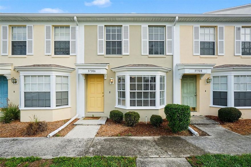 Some photos have been virtually staged.    Move in and feel at home immediately.   The front bay window brings I the light and welcomes you into the living/dining area and into the kitchen.   The kitchen island is a surprise as well as the marble counter tops and stainless appliances.   The laundry area has custom shelving with space to hand clothes and a little extra storage.   Completing the first floor is the ½ bath with marble counter tops.    Upstairs both bedrooms have spacious custom closets and the bath is completed with marble counter tops.    Thru out the home you will find   luxury vinyl plank flooring, upgraded fans and light fixtures, and fresh paint.     Outside you can relax on the private rear patio or enjoy the community pool which is just a few steps from your front door.