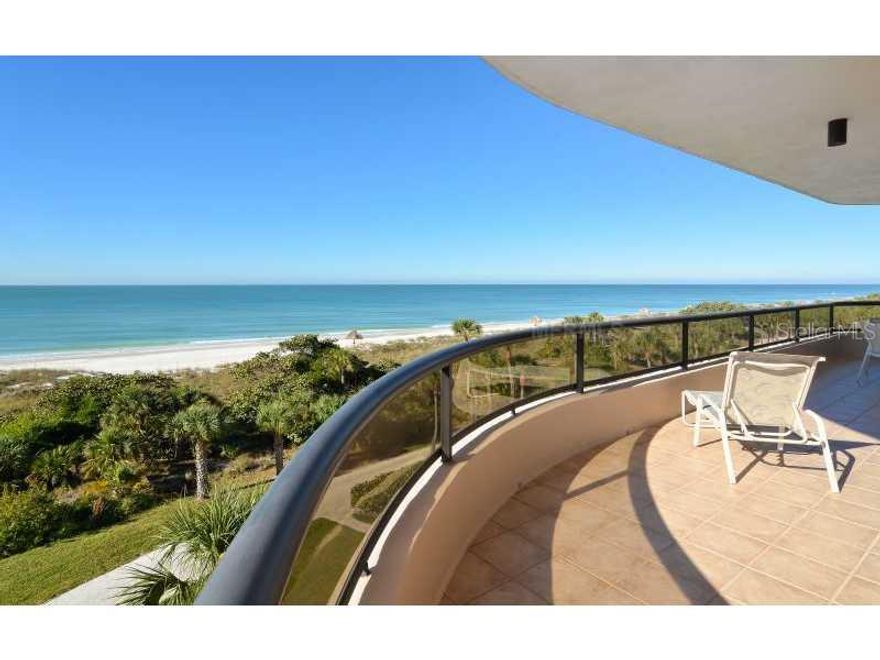 This stunning, southwest-facing Royal residence at L'Ambiance welcomes you with panoramic Gulf views that stretch on forever. With walls of floor-to-ceiling glass (hurricane shutters on all Gulf windows), the grand living room is a statement of beachfrontliving, featuring sparkling turquoise vistas at every turn. The terrace wraps around the residence from the kitchen to the master and is the ideal place to relish breathtaking sunsets and while the day away enjoying wonderful Gulf breezes. Polished marble flooring leads to the pristine, eat-in kitchen with all-white cabinets, Corian countertops, stainless steel appliances, Sub-Zero refrigerator and tray ceiling. When overnight guests visit, you will delight in the split bedroom plan that allows for virtual privacy. The master is a great retreat with direct access to the Gulf front terrace, hardwood flooring, convenient built-ins with work desk, plus his and hers baths and walk-in closets. The guest suite has its own private terrace and the third guest bedroom (currently being used as a den) features a wall of custom built-ins and en-suite bath. The current owners have also converted the half bath to a full bath and the study is now a bonus room with twin beds.  L'Ambiance is a premiere Gulf front community ideally situated behind the gates of Longboat Key Club's Islandside facility. Residents enjoy 24-hour security and concierge service, a stylish clubhouse, social rooms, fitness, tennis, heated swimming pool, spa and is just steps to the beach.