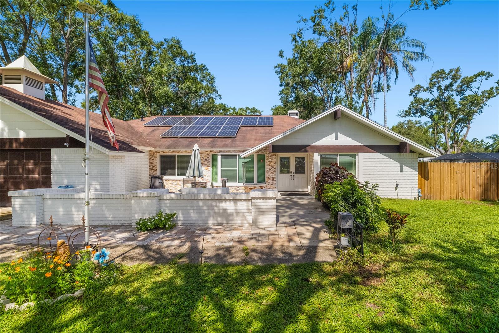 Welcome home! Your very own slice of genuine Florida living is waiting for you. Towering shade trees create a peaceful, inviting atmosphere from the moment you arrive—perfect for relaxing and escaping the everyday.
Step inside to find wide hallways and spacious, open rooms that flow seamlessly from one to the next. Multiple bedrooms have plenty of space for visiting guests or extended family to enjoy. The newly remodeled kitchen, featuring sleek stainless steel appliances, is a dream for the culinary enthusiast ready to create and entertain.
The large primary suite provides a comfortable retreat at the end of the day—whether you’ve been working hard or making memories with loved ones in your impressive 18x35 pool (30,000 gallons, 10 ft deep with a 3.5 ft shallow end). Out back, a fantastic covered deck invites you to barbecue, entertain, or simply unwind while overlooking your half-acre property and enjoying the sights of Florida’s natural fauna and flora.
This home is designed for both comfort and peace of mind with impact glass, solar panels with battery backup capable of powering the entire home, pull stations at exits, a sprinkler system, and bathrooms modified for accessibility.
Don’t miss this unique opportunity—schedule your showing today!
