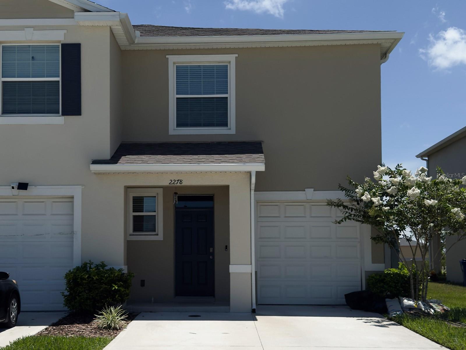 Modern 3-Bedroom, 2.5-Bathroom Townhouse built in 2023 in the Thompson Grove community. This gorgeous home comes with a renovated garage, an open floorplan downstairs, and three spacious bedrooms upstairs. The kitchen features a dishwasher, range, refridgerator, and a microwave, as well as a pantry located under the stairs. The half-bathroom downstairs allows for guests to freshen up without having to go upstairs. As we go upstairs, we're met with the laundry closet, housing a washer and dryer, as well as a loft, perfect for more-private family time. The master suite has two walk-in closets, with one of them being located in this beautiful bathroom. The last two bedrooms share a bathroom, as a typical Jack and Jill setup. This townhome is in a great location, as Saint Cloud is constantly growing. Don't miss this opportunity, see this home today!