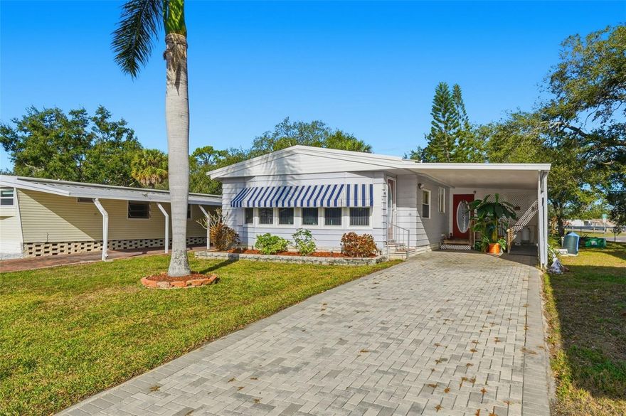 One or more photo(s) has been virtually staged. Welcome to Clearwater Cascade, one of Clearwater’s most desirable 55+ active communities, where resort-style living meets everyday comfort. This spacious double-wide manufactured home can be sold fully furnished, offering a truly move-in-ready opportunity. Inside, you’ll find 3 bedrooms, 2 bathrooms, an extended kitchen, a large Florida room, and an indoor laundry room. The open living and dining areas create an inviting space for entertaining and flow seamlessly into the kitchen. The primary suite features a generous walk-in closet and a private en-suite bath. Step outside to enjoy a sizable shed with access to a lovely back patio overlooking a serene canal—an ideal setting for morning coffee or relaxing evenings with peaceful water views. Clearwater Cascade is known for its vibrant lifestyle and outstanding amenities, including two heated pools, a hot tub, sauna, clubhouse, library, fitness room, and a full calendar of daily activities and social events. Enjoy everything from billiards, ping-pong, shuffleboard, bocce ball, and golf leagues to dances and special monthly gatherings. Conveniently located near shopping, dining, and public transportation, this well-maintained community offers the perfect balance of comfort, convenience, and connection. For added peace of mind and long-term value, the vapor barrier was recently replaced within the last year. The $55,000 land share is included in the price.