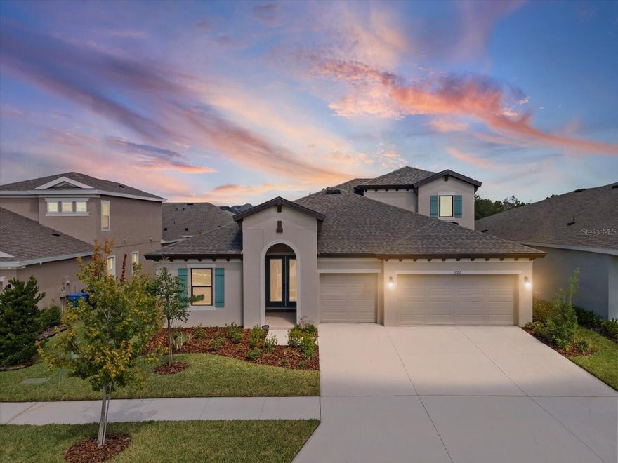 Highly upgraded WestBay Bayshore II priced at $899,999 to reflect a true finished-home comparison to new construction, with over $100K in builder upgrades already completed. This 4-bedroom, 4-bath home also includes a private office and an upstairs bedroom, full bath, and bonus loft, offering flexibility and function well beyond a standard 4/4. A custom-built heated saltwater pool and spa, completed less than one year ago, anchors the home’s resort-style indoor–outdoor living experience. The home has been lightly lived in and meticulously maintained.

Soaring first-floor ceilings and custom wood beams across the living and dining areas create immediate architectural impact. The open-concept layout flows into a chef’s kitchen featuring Sonoma Linen cabinetry, Calacatta Novello quartz countertops, stainless steel appliances including the refrigerator, an oversized extended island with integrated table seating, and luxury plank flooring throughout the main living areas. The kitchen also includes upgraded extended cabinetry and countertop space ideal for a coffee or beverage bar, with both upper and lower cabinets thoughtfully placed around the window, adding everyday functionality and visual balance.

An upgraded 24-foot sliding glass door system spans the entire back wall, opening to an upgraded extended covered lanai that stretches the full width of the home, creating a seamless connection between the interior living spaces and the outdoors—ideal for entertaining and everyday living.

A private office with double-door entry and tray ceiling provides a refined work-from-home or flex space, while the upgraded extended laundry room adds convenience and storage rarely found in comparable layouts. The primary suite serves as a true retreat, featuring a tray ceiling, dual walk-in closets, private access to the pool, and a spa-inspired bath with dual sinks, a soaking tub, and a walk-in shower. A guest bedroom includes a standing walk-in shower, ideal for visitors or multigenerational living.

Upstairs, the home offers a private bedroom, full bathroom, and spacious loft, creating an ideal guest suite, teen retreat, or secondary living area with separation from the main level.

Outdoors, enjoy a heated saltwater pool and spa with three sheer descent waterfalls that create a soothing, resort-style sound, complemented by LED multi-color lighting. The pool is controlled via the iAquaLink system and app, fully screen-enclosed, and surrounded by pavers that extend through the expanded lanai and completely around the pool deck area, creating a cohesive, low-maintenance outdoor living space designed for year-round enjoyment.

Additional upgrades include a tankless gas water heater and dual HVAC systems, roof gutters, raised AC units, and a professionally installed sump pump drainage system directing water from the backyard to the street. The oversized 3-car garage features epoxy flooring and is currently configured as a home gym with commercial-grade equipment (negotiable). The entire yard has been refreshed with new underlayment and bark landscaping throughout. Located in the Waterset master-planned community with resort-style amenities, trails, and nearby dining and retail. High and dry with no flood insurance required. Move-in ready and truly exceptional.