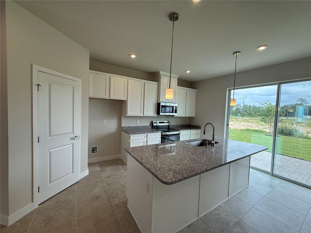 Photo of 1235 Pineywood Field Drive, Davenport, FL 33837 (MLS # W7885336)
