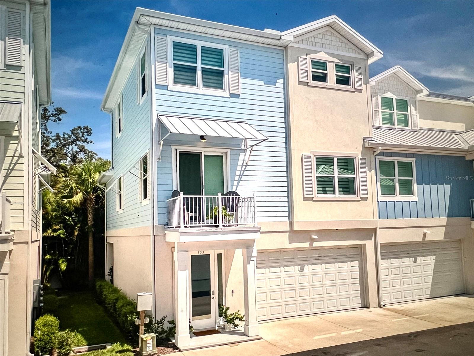 Welcome to the best of Downtown Dunedin living in this stunning 2390 sq ft townhome with superior ICF (Insulated Concrete Forms) construction, cement siding and a metal roof built in 2023. This intimate complex of townhomes, will be the only newer construction Downtown neighborhood with a swimming pool! Bright and beautifully chic aptly describes this pristine 3 bedroom, 3 1/2 bath townhome in the highly sought after vibrant Downtown Dunedin golf cart area, tucked deep into the neighborhood for peace and quiet and privacy. This elegant end unit home features plenty of natural light and room to grow in this well laid out floorplan, with arguably the best layout in the neighborhood, with an ELEVATOR seamlessly connecting the 3 levels. This delightful home features 3 generous bedrooms, a dining area, a spacious living room, and a culinary enthusiast's dream kitchen. The kitchen showcases pristine granite countertops complemented by a spacious island, sleek white 42" cabinetry, and high-end stainless steel appliances including a gas range. The tranquil primary suite is located on the third floor for privacy; with its airy dimensions and a sumptuous ensuite bath that boasts dual vanities set in stunning granite, alongside a frameless glass shower and an amazing walk in closet. The home's second and third bathrooms mirror this modern aesthetic with its streamlined fixtures and granite surfaces. Privacy and entertainment seamlessly merge in the home's outdoor living spaces, featuring a private patio, and 2 balconies, including a private balcony off the 2nd floor bedroom. This home boasts superior architectural touches such as; engineered hardwood flooring, 6-inch baseboards, towering 10-foot ceilings, LED lighting, modern light fixtures, open floor plan, neutral color tones, silhouette blinds, 8" trimmed windows casings, solid core 8 ft interior doors, tankless gas hot water heater, and CA Closets. The 4 car garage is an exceptional space that can house, your golf cart, kayaks, jet skis, workshop or a fun "Man Cave" with access to the back patio. The garage also has a 1/2 bathroom for convenience while entertaining outside. This also gives the option of building a bedroom on the ground floor. This home does not compromise on comfort or elegance. This delightful home also has energy-efficient hurricane impact windows and offers ample storage solutions. This chic home's location is unparalleled—a leisurely walk or easy golf cart ride to downtown dining, Pinellas Trail, parks, shopping and festivities. This home's low maintenance "lock and leave" ability makes it the perfect home for buyers who like to travel or just want worry free living and more time to spend at the beach or downtown. This home is the quintessential Florida lifestyle home: offering highly rated schools, pristine beaches, and everything delightful Dunedin has to offer.