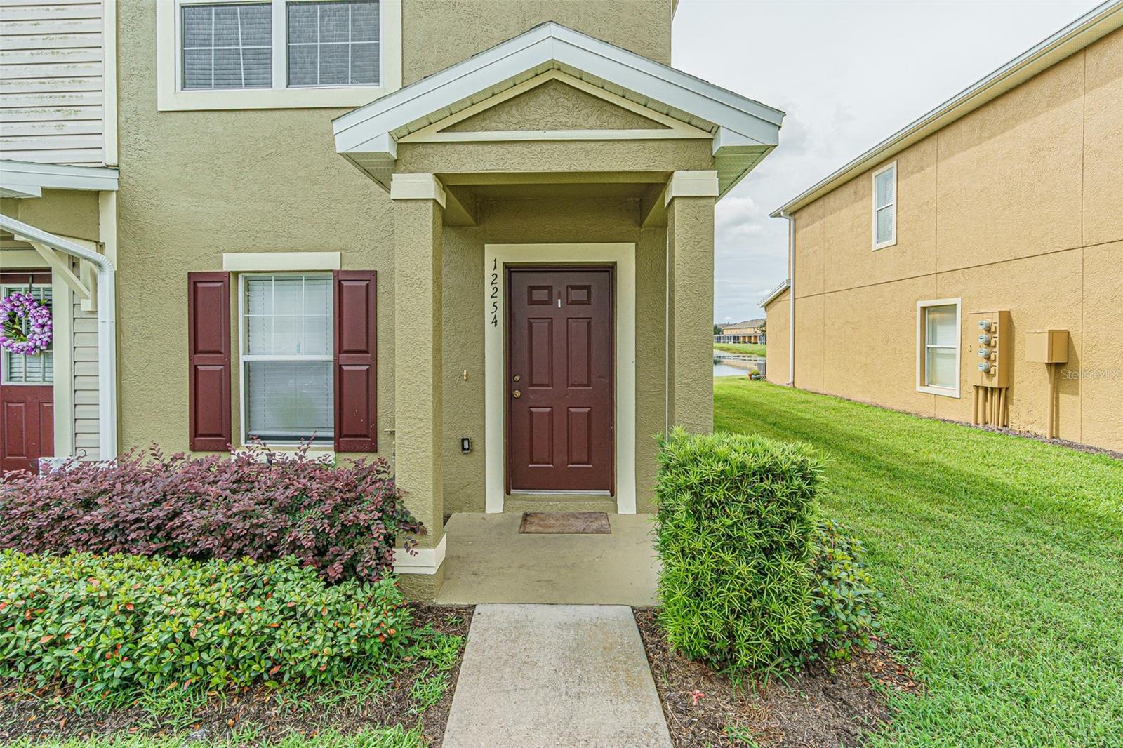 Come view this adorable end-unit townhome. Feature 2 bedroom, 2.5 bath, with a screen covered patio. NO water bill and NO CDD. The water bill is included in the monthly HOA fee. Located in the Panther Trace gated community. This beauty features an open floor plan with new carpet, freshly painted inside and out. The kitchen features stainless steel appliances, wood cabinets, decorative laminate flooring and a beautiful view of the large pond. HOA includes full lawn care including fertilization, pest control, irrigation, community pool(s), trash & water. You will also have access to Panther Trace main resort style pool. This property is location close to I-75, many restaurants, grocery stores, medical centers and more! Schedule an appointment to see it today!