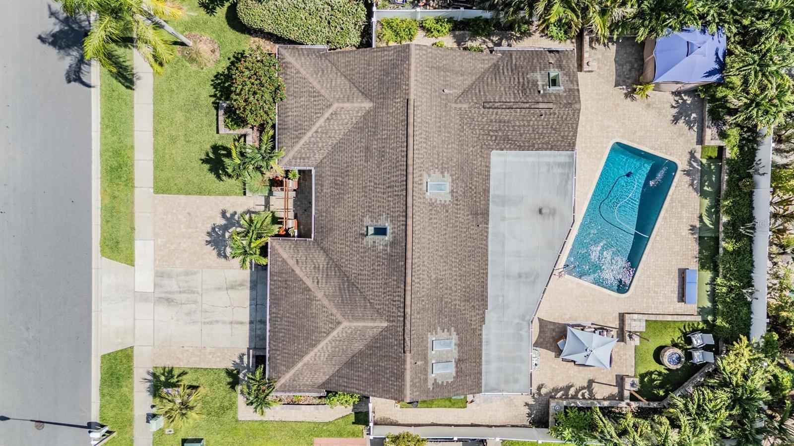 Welcome to your own slice of paradise—this stunning, beautifully cared-for home offers a thoughtful blend of comfort, style, and function. With 3 spacious bedrooms plus an office and 2 full baths, every detail has been meticulously upgraded to create a true sanctuary.Step outside and you’re greeted by a 14x28 saltwater pool with a deep 8.5 ft end and rich Pebble Tec finish—perfect for peaceful lounging or fun-filled weekends. Surrounded by lush, mature landscaping and a cozy propane fire pit, the backyard feels like your own private resort.
Located just over 2 miles to Honeymoon Island and the charm of downtown Palm Harbor, you’ll love the convenience as much as the curb appeal—thanks to the paver driveway and tropical greenery that welcomes you home.Inside, you’ll find soaring vaulted ceilings, elegant flooring, and thick baseboards that add warmth and richness throughout. The remodeled kitchen is a showstopper, with solid surface counters, stainless steel appliances, and soft-close cabinets. The remodeled primary bath includes a double vanity, walk-in shower, and soaking tub. Every closet is outfitted with built-in systems for maximum organization.
This home is the perfect mix of relaxed Florida living and modern convenience. Plus, it comes complete with cabana/patio furniture, Ring doorbell, utility fridge, storage shed, and pool box—just move right in and start enjoying!
Pride of ownership shines throughout—come see for yourself what makes this home so special.