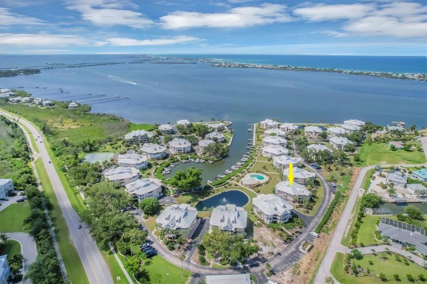 Resort living in comfortable luxury with on-site marina plus beach access provided by a private ferry! This 3-bedroom 3-full bath waterfront condominium in the Placida Harbour Club has 18’ tile in the foyer and entry, wood floors and volume ceilings in the main living areas, and two bedrooms with two full baths. A large loft on the second level has an alcove area, closet, and full private bath, serving as an ideal space for a third bedroom, office or den. This top floor end unit is in a building with only 4 units and has elevator access. The  large two car garage has added space for a golf cart or boat trailer plus enclosed locked storage. All hurricane impact windows throughout and electric roll down shutters on the water facing screened lanai plus a brand-new metal roof and air conditioner, both in 2024! The kitchen is open to the dining and living area with lots of natural light from the bay windows. Granite countertops with wine refrigerator and lots of cabinet space including a pantry. All bathrooms have been tastefully renovated with granite countertops and beautifully tiled showers. Watch the manatees who live in the Harbour with ICW views from the large screened and tiled lanai. The marina is on site and in the process of a major renovation with new seawall, docks, electric and dredging. Plans are available to view. There are three pools, tennis and pickleball courts, hot tub, fully equipped fitness center and a clubhouse which is  available for special events to owners and their guests. What sets Placida Harbour amenities apart is the ferry to a private beach with day docks and a pool on Little Gasparilla Island. Truly a resort style community! Freshly painted inside as well as the exterior, plus the entire community is in the process of all new landscaping being installed, roads being paved and new and improved gate system for easy and safe access for you and your guests. Offered furnished.