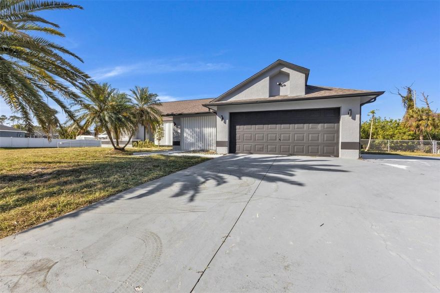 X FLOOD ZONE - WOW!!!! 5-bedroom, 3-bathroom home in the heart of Port Charlotte! RV PARKING- FENCED- UPDATED THROUGHOUT. Nestled on a spacious corner lot, this meticulously maintained property is ideal for families or anyone in need of extra room to live, work, and entertain. Inside, you'll be greeted by 1,933 sq. ft. of thoughtfully designed living space, complete with brand-new appliances and modern finishes. The expansive, fully fenced backyard offers endless possibilities—whether you’re hosting gatherings, gardening, or letting your pets roam freely. A shed provides additional storage, while the attached 2-car garage ensures added convenience. Located just minutes from schools, shopping, and dining, this move-in-ready treasure combines privacy with accessibility. Don’t miss your chance to make this exceptional property your forever home. Schedule your private showing today!
