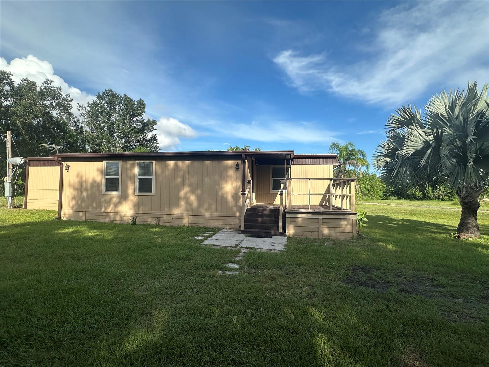 WELL KEPT SPACIOUS MOBILE HOME SITUATED ON 5 ACRES ON THE BORDER OF KISSIMMEE/ST. CLOUD. THIS PROPERTY FEATURES 3 BEDROOMS 2.5 BATHROOMS WITH 2 SHEDS AND A BARN. NO HOA TO DEAL WITH. CONVENIENTLY LOCATED WITH EASY ACCESS TO THE FLORIDA TURNPIKE, AND SHOPPING. DONT MISS OUT ON MAKING THIS YOUR NEW RENTAL HOME.