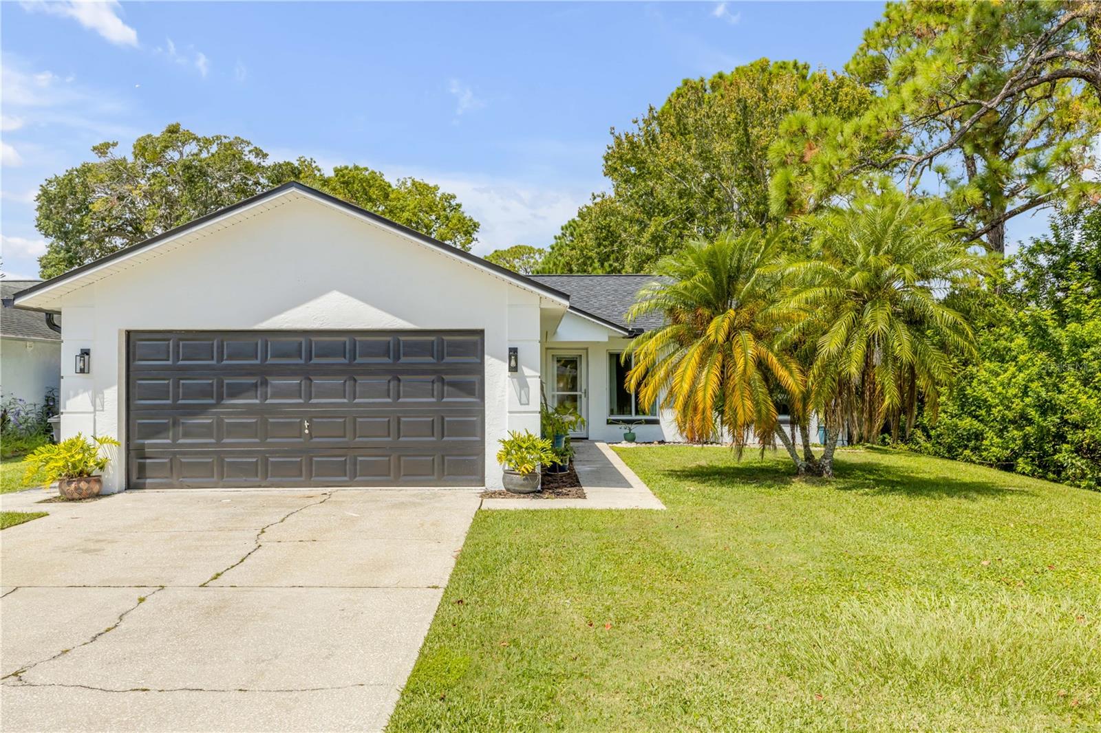 This beautifully maintained pool home in the desirable Harbour Town Village community offers both comfort and value. A NEW roof (2025), Hurricane-Rated Windows, and a 2017 AC system provide peace of mind, while recent upgrades include a newly updated kitchen and a freshly screened pool enclosure.
Step inside to find an open concept, split floor plan with vaulted ceilings and skylights that create a light and spacious feel. The primary suite features a large walk-in closet, dual sinks, and a step-in shower. A spacious two-car garage and a fully fenced yard add extra convenience.
The backyard oasis with pool is perfect for entertaining or relaxing year-round. This established neighborhood includes sidewalks for easy evening strolls. Conveniently located within Port Orange’s school zone for Port Orange Elementary, Silver Sands Middle, and Spruce Creek High School. Only 3.5 miles to the beach and 2.7 miles to dunlawton boat ramp.
Whether you’re looking for a primary residence, seasonal retreat, or investment property, this home checks all the boxes.