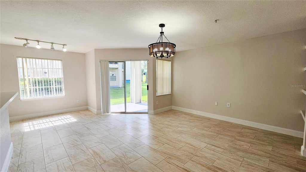 Photo of 7330 Westpointe Boulevard #412, Orlando, FL 32835 (MLS # O6447442)