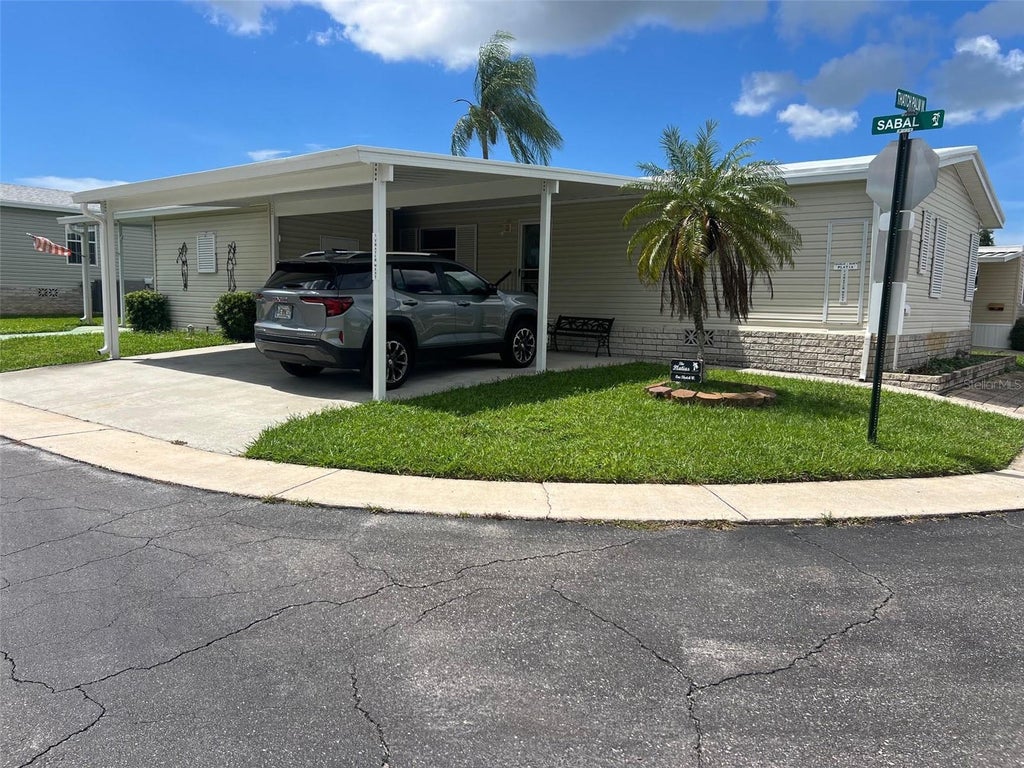 Photo of 1 Thatch Palm Street W, Largo, FL 33770 (MLS # TB8547179)