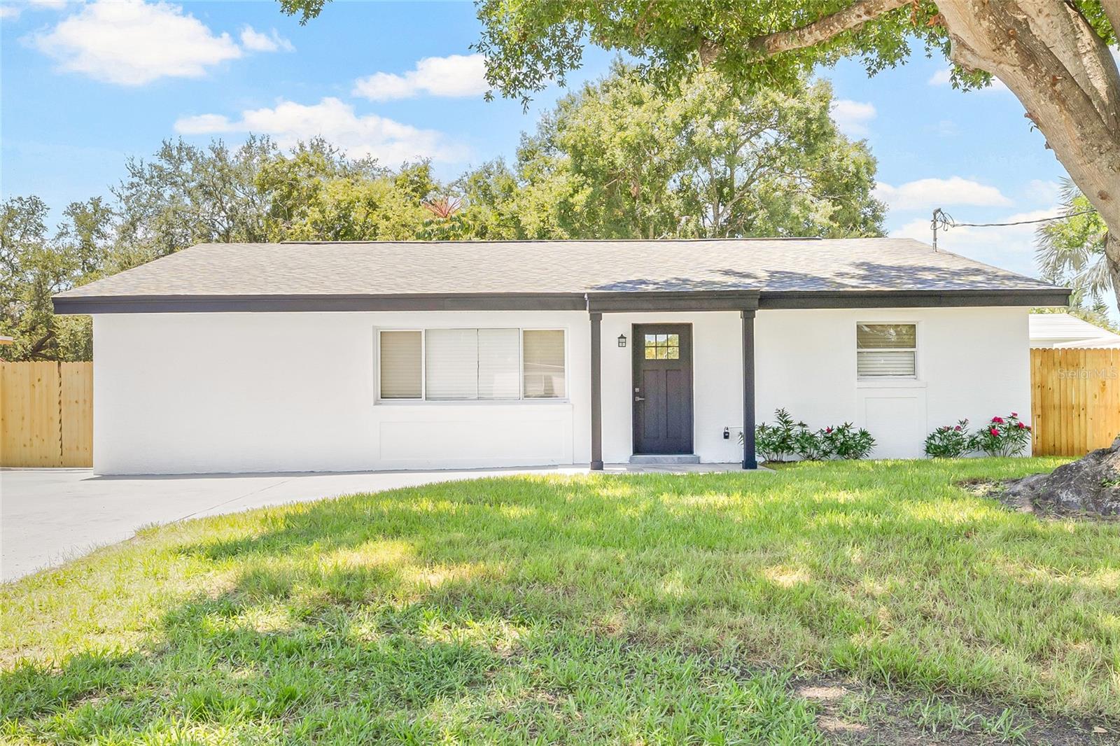 Welcome to your dream home in South Tampa! This beautifully renovated 4-bedroom, 3-bathroom home offers modern comfort with stylish charm, starting with its inviting curb appeal. Step inside to brand-new luxury vinyl plank flooring that flows seamlessly throughout the home. The bright and airy living room welcomes you in and effortlessly connects to the show-stopping kitchen, complete with all-new stainless steel appliances, abundant cabinetry, and sleek finishes. Just past the kitchen, the spacious dining area is perfect for gathering and making lasting memories. The cozy family room is ideal for relaxing evenings by the fireplace or weekend movie nights. Off the family room, you’ll find a convenient laundry room featuring a brand-new washer and dryer, counter space, and built-in cabinetry for extra storage. This thoughtfully designed layout offers two guest bedrooms and a full guest bath at the front of the home. One primary suite also sits toward the front, featuring vaulted ceilings and a private en-suite bathroom. A second, more secluded primary suite is located off the dining area, offering a trendy en-suite bath and a generous walk-in closet—perfect for multi-generational living or added privacy. Step outside into your own private retreat: a fully fenced backyard with a covered patio and sparkling pool, perfect for entertaining or simply unwinding. A storage shed provides even more space for tools or pool gear. Enjoy peace of mind with a brand-new roof, HVAC system, and water heater—everything is move-in ready, and the home stayed high and dry during last year’s hurricane. Located near vibrant Hyde Park, just minutes from Armature Works, shopping, dining, and under 30 minutes to the beaches, this home offers both convenience and lifestyle. Don’t miss your chance to own this beautifully updated gem in one of Tampa’s most sought-after areas.
