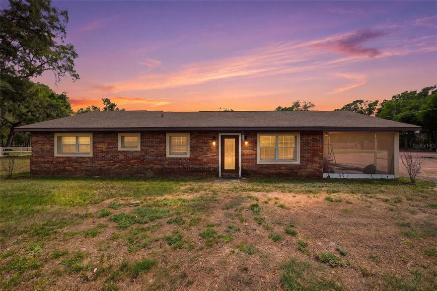 Welcome to your private retreat where modern luxury meets country living, privacy, and cutting-edge smart living. This beautifully updated 3-bedroom, 2-bathroom block home offers over 2,000 square feet of elegant living space, perfectly situated on nearly 2 acres of usable land.
Step inside to discover a thoughtfully upgraded interior featuring marble-style tile flooring throughout, sleek quartz countertops, tray ceilings, and crown molding that elevate every space. The updated bathrooms provide a clean, modern feel, while the dedicated laundry room—complete with a washer/dryer combo—also features a separate entrance, making it ideal for easy clean-up after working outdoors, with animals, or in the garden.
One of the standout features of this home is the fully integrated ELAN whole-house system, valued at over $100k includes TVs and security cameras! This high-end smart home technology allows you to control lighting, built-in surround sound, TVs, and a comprehensive security system with cameras—all seamlessly from your device. Whether you're hosting guests or enjoying a quiet evening, the ambiance and convenience are unmatched.
Outdoors, the property is just as impressive. Enjoy peaceful mornings on the screened porch overlooking your expansive land, complete with masonry horse stalls, a garden greenhouse, and a storage shed for added functionality. Major systems up to date including roof, septic system, well, and a brand water softener—providing both comfort and peace of mind. 
This is a rare opportunity to own a property that combines modern luxury, advanced technology, and acreage living—all in one.
