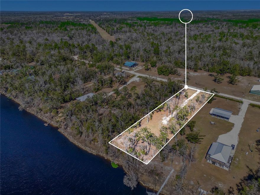 Welcome to The Trails! This beautiful 1-acre parcel sits along the historic Suwannee River, the perfect setting to relax, unwind, and watch the water drift by. Located in a gated community by a private air park with its own airstrip, this property offers a rare blend of peaceful riverfront living and aviation adventure.
Just miles from Peacock Springs and a public boat ramp, and approximately 15 minutes to both Live Oak and Mayo, you’ll enjoy privacy without sacrificing convenience. Whether you love boating, fishing, flying, or simply soaking in nature, this property is ideal for outdoor and water enthusiasts looking for something truly unique!!