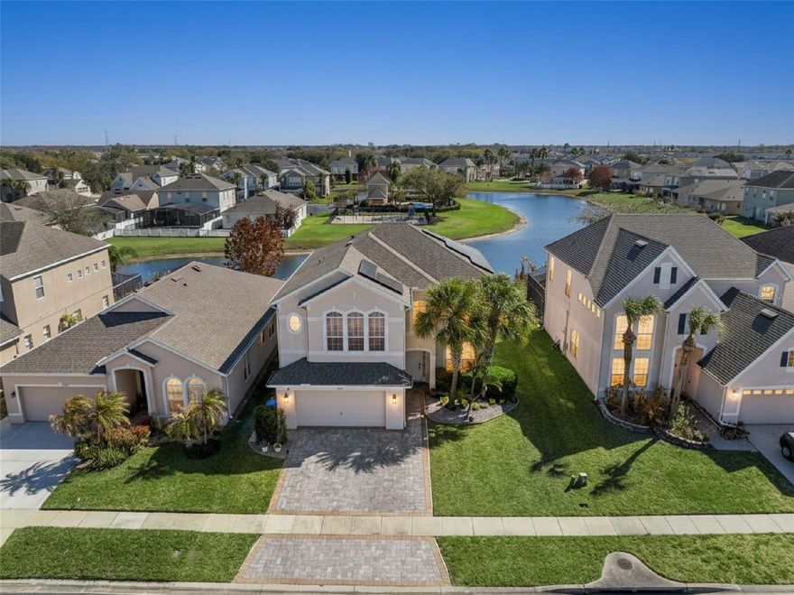 Welcome to 1260 Darnaby Way in the gated Harbor Lakes community of Orlando! Enter this updated home via new paver driveway and sidewalk into an elegant formal living room which flows to a formal dining.
Remodeled kitchen features new cabinets, upscale granite countertops with waterfall edge and pop-up charging station, 42" uppers with crown molding, high-end LG stainless appliances and eat-in kitchen area. Kitchen opens to large family room; powder bath completes first floor.
Upstairs: spacious master suite, airy loft with bonus office space or reading nook, three more large bedrooms. LVP flooring throughout both levels with tile in kitchen.
Over 3,000 sq ft plus huge screened patio with lake views and no rear neighbors. Paid-off solar offers near 100% electric bill offset. Whole home water filtration system can remain (negotiable). Over $100k in upgrades including pavers, kitchen and bath updates, 2021 roof, new water heater, and 5-year-old AC. Conveniently located near theme parks, Lake Nona, shopping, the Loop, and major highways with community pool and playground access.