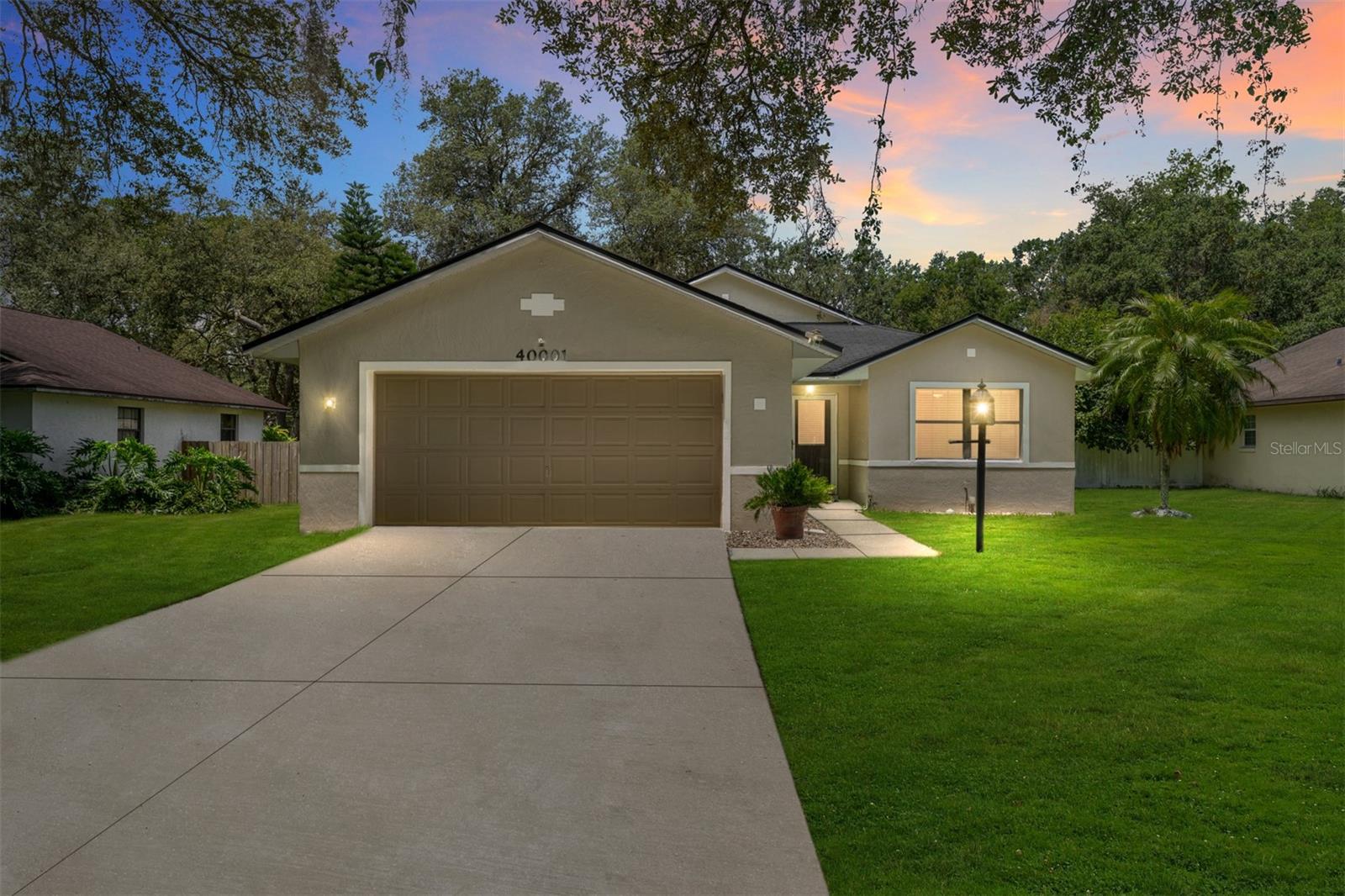 Beautifully updated and move-in ready, this recently renovated home offers a perfect blend of comfort, function, and peace of mind—having just passed a full 4-point inspection. Inside, you'll find soaring cathedral ceilings and a spacious family kitchen with a breakfast bar, eat-in area, and ample cabinetry. The split-bedroom layout provides privacy, while the primary suite features a tiled walk-in shower. An added den opens to a fully fenced backyard retreat with a paver patio and built-in fireplace—ideal for entertaining. Additional highlights include updated appliances, fresh exterior and interior paint, new flooring throughout the living space, and a 13’x10’ storage shed. The location offers a charming Old Florida feel, while still providing convenient access to The Villages, Lady Lake, Ocala, and even Orlando. Don’t miss your chance to own this well-maintained, thoughtfully updated home.