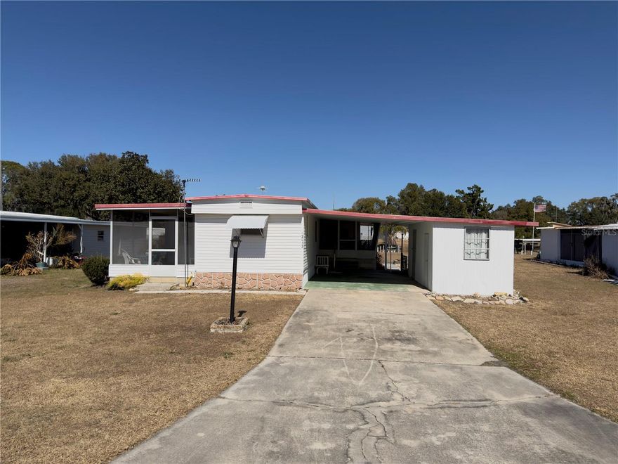 Opportunity Awaits for the Harris Chain of Lakes! Welcome to 12033 Lake Pines Rd, Leesburg, FL, a charming 2-bedroom, 2-bath manufactured home offering direct canal-front access to Lake Eustis and the renowned Harris Chain of Lakes—one of Central Florida’s most desirable boating and waterfront lifestyles.

This 1970 (single-wide) manufactured home is perfectly positioned on a navigable canal, providing easy access to miles of interconnected lakes ideal for boating, fishing, kayaking, and sunset cruises. Inside, the home features a functional split-bedroom layout, spacious living areas, and comfortable accommodations for full-time living, a seasonal retreat, or an investment opportunity.

Enjoy peaceful water views, mature surroundings, and the laid-back lake life that makes Leesburg waterfront homes so sought after. Whether you’re casting a line from your backyard, cruising through the Harris Chain, or relaxing after a day on the water, this property delivers true Florida lake living at an attainable price point.

Located just minutes from Tavares and Leesburg, with shopping, dining, medical facilities, and year-round community events nearby, this canal-front home offers the perfect balance of tranquility and convenience.
This property is being sold As-Is, cash only, and inspections are for the buyer's information only.