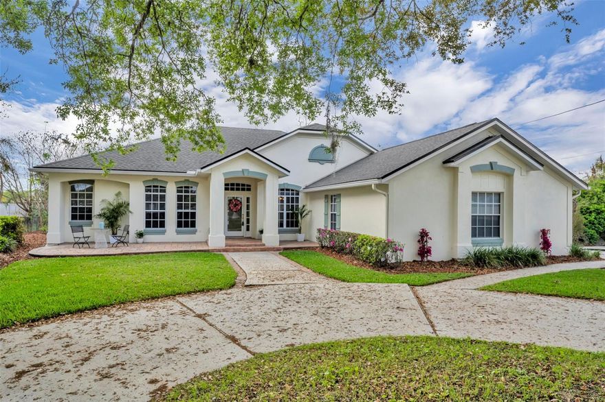 One or more photo(s) has been virtually staged. Experience refined living in this exquisitely renovated custom home, positioned on an oversized corner lot in one of the area’s most peaceful and private neighborhoods. Tucked away at the end of a quiet dead-end street, this residence offers an exceptional blend of craftsmanship, sophistication, and modern comfort. Inside, soaring 10-foot ceilings and a stately wood-burning fireplace set a welcoming tone in the family room. The fully reimagined chef’s kitchen is a true showpiece, featuring solid maple cabinetry, quartz countertops, programmable Bosch stainless steel appliances, and a striking brick backsplash—an elevated space designed for both culinary creativity and effortless entertaining. All three bathrooms have been luxuriously renovated, and new carpeting adds a soft, refined touch throughout all four bedrooms. French doors from the master suite, formal living room, and family room open to a breathtaking screened-in pool retreat. Surrounded by lush tropical landscaping, this private oasis has been thoughtfully upgraded with a new pool pump, a conversion to a sparkling saltwater system, and a beautifully refinished pool deck. An outdoor shower with both hot and cold water adds a resort-level convenience, perfect after a swim or a day in the sun.  Every major system has been meticulously updated for peace of mind, including a new programmable HVAC system, a complete replumb of the entire home, all new ductwork, and an upgraded water heater. Additional enhancements—such as fresh interior and exterior paint, a new garage door opener in the over-sized garage and refreshed landscaping — ensure a truly turnkey experience. With its luxurious finishes and meticulous improvements, this residence is ready for the next family to make it their own. Just minutes from Winter Park’s boutiques, acclaimed restaurants, and the cultural charm of Park Avenue, this home offers a rare opportunity to enjoy elevated living in a setting that’s both secluded and connected. A truly private sanctuary designed for comfort, style, and the best of Florida living.