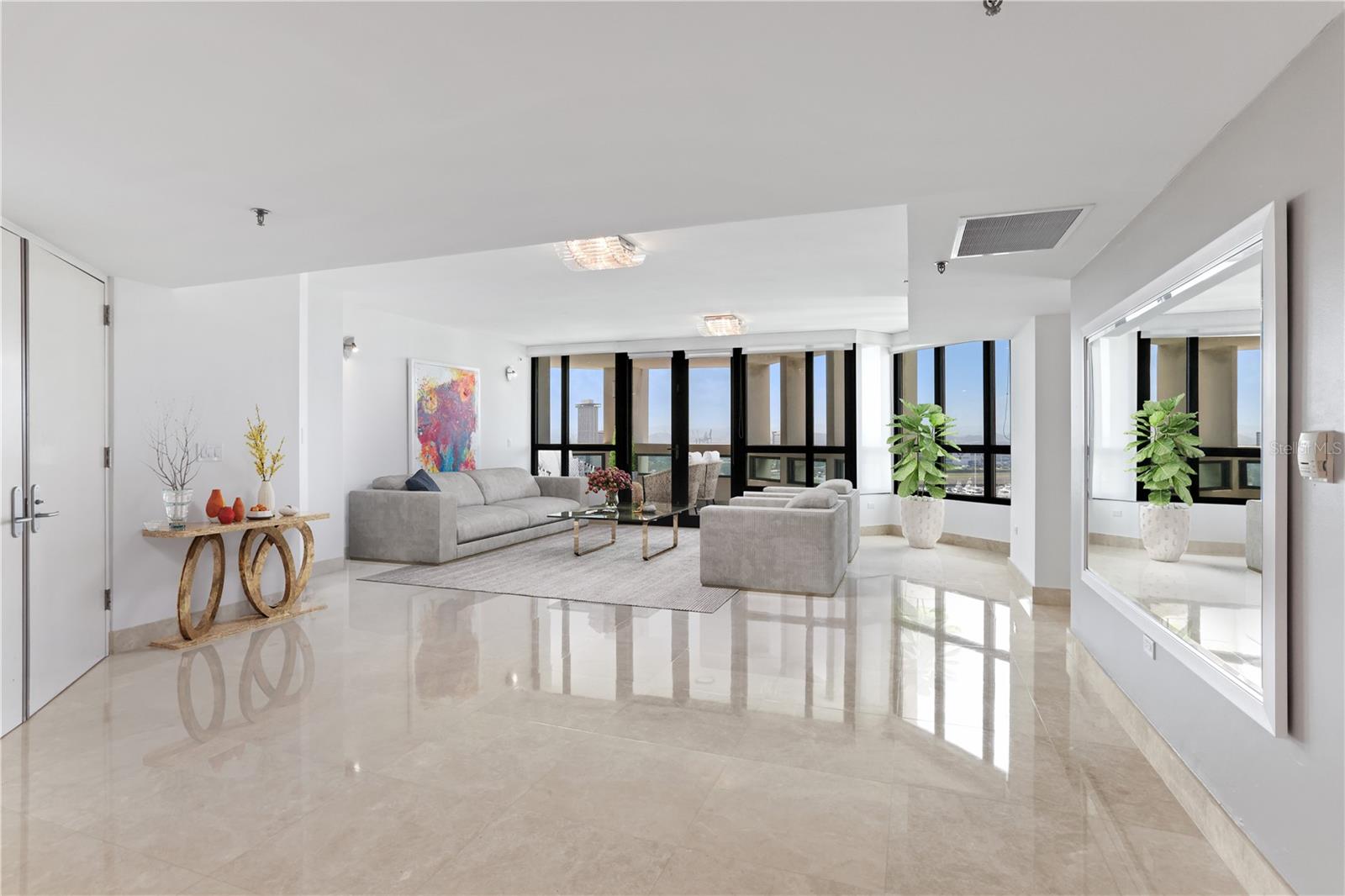 One or more photo(s) has been virtually staged. Discover the pinnacle of luxury living at Caribe Plaza, where elegance meets breathtaking vistas of San Juan Bay Marina, Condado Lagoon, Old San Juan, and the Convention Center. This residence boasts newly renovated marble floors and opens to a private lobby that flows into a spacious great room, seamlessly connecting the dining area, family room, and a gourmet kitchen equipped with top-of-the-line appliances. The primary suite serves as a tranquil retreat with dual closets and an en-suite bathroom. Two additional en-suite bedrooms and a versatile flex room provide ample space, complemented by four full bathrooms and a powder room. Recent enhancements include new vanities, lighting fixtures, and security windows. The property includes three side-by-side parking spaces and a temperature-controlled storage room. Designed for convenience and resilience, the building features a full-power backup generator and a water cistern. Residents enjoy premium amenities such as 24-hour security, concierge and valet services, a fully equipped gym, a heated pool, and an activity room. Perfectly located, Caribe Plaza is steps from Luis Muñoz Rivera Park, the Caribe Hilton Hotel, and Escambrón Beach, with easy access to Condado's top restaurants, shopping, entertainment, and schools. The vibrant Distrito T-Mobile and historic Old San Juan provide endless leisure and exploration opportunities. This property elevates to an unmatched lifestyle in one of San Juan's most sought-after locations. Truly move-in ready and available for sale for the first time!