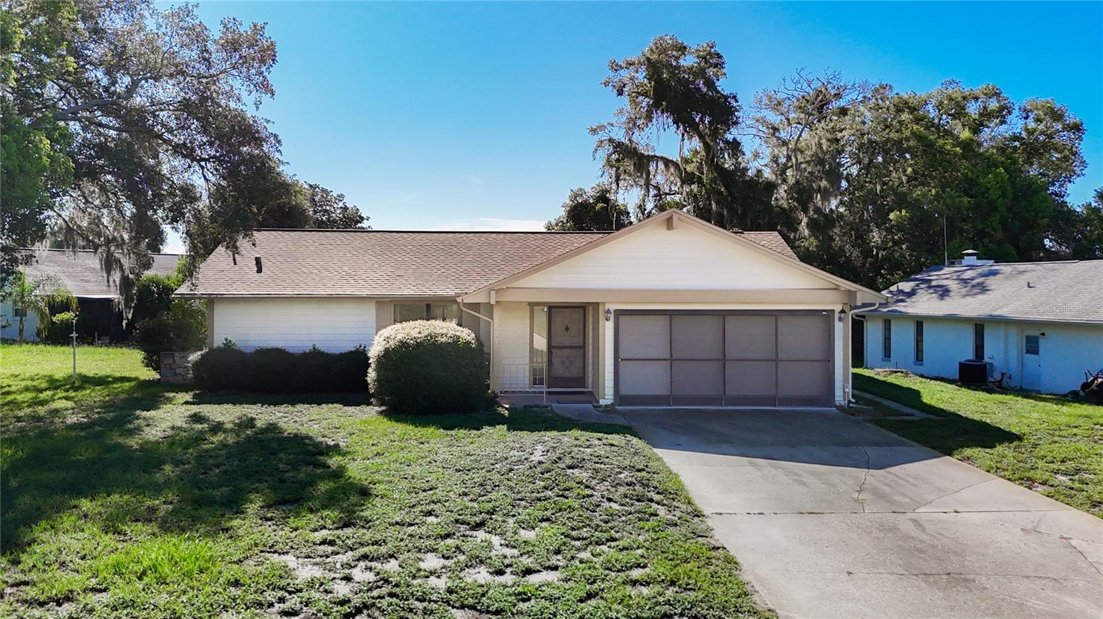 Welcome to this delightful two-bedroom, two-bath home located in The Heather, a community that offers a semi-private golf club and family-oriented activities of your choice. This home offers seamlessly blends comfort, functionality, and a touch of Florida charm. Ideal for couples, small families, or those seeking a space that balances privacy with inviting communal areas, this home offers an exceptional living experience. The kitchen offers ample space for all your cooking needs and features newer appliances and a new garbage disposal. The open concept of living and dining area forms the heart of the home. This versatile space is perfect for entertaining or enjoying quiet evenings in. Large windows create a bright and airy atmosphere, while the layout allows for seamless flow between lounging, dining, and hosting gatherings. Each bedroom is thoughtfully designed to provide a peaceful retreat. The primary suite includes a walk-in closet and a private bathroom for added convenience. The secondary bedroom features cedar closets and is perfect for guests, a home office, or creative pursuits, and is adjacent to the second full bathroom. Enjoy a peaceful evening or your morning coffee in the expansive vinyl-enclosed lanai with a laundry room including newer washer & dryer, and extra storage closet. Other amazing features include Roof 2019, AC 2024, newer water heater, newer exterior paint, comfort height toilets. Get creative while living here and redesign with your own modifications that you’ve been dreaming of. LOW HOA, NO FLOOD INSURANCE. Lots of shopping and favorite local dining options nearby. Minutes from the famous Weeki Wachee live mermaids, Pine Island Park and Roger’s Park for fun on the water. Close to the Suncoast parkway for quick access to the airport, Tampa, Clearwater and St. Pete Beaches (Ranked in the top 5 Beaches in the US), also close to the famous Tarpon Springs Sponge Docks. Enjoy everything Tampa Bay has to offer from the new Downtown Riverwalk, TOP US BEACHES, boating, fishing, golfing, cultural entertainment, and museums...and of course beautiful year-round weather! The community features Community Center which has the Library, Horseshoe Area, Shuffleboard Courts, Picnic Tables and BBQ Grills.