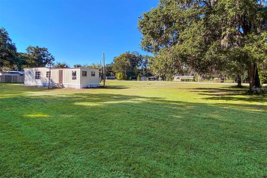 HALF ACRE, Cleared, Flat, Dry, and Ready! YOU OWN THE LAND - No Lot Fee. Electricity on site. Off CoRd 309 near Hwy 17. Build now, later, or hold for investment. Mobile Homes ARE Allowed. 165'x132.12' St. Johns Riverside Estates in Satsuma! Enjoy all that Putnum County has to offer and more! Dunn's Creek, Lake Broward, Crescent Lake, Lake George, Equestrian Center, Welaka State Forest, Oaks Golf Club, Palatka Historic District, Palatka Shopping, Dining, and Entertainment, Palatka Municipal Airport, St Johns River, 45 mins to Palm Coast and Flagler County Beaches. Satsuma Fire and Rescue, and Post Office just blocks away. Hard-packed dirt road. Well and pump needs reconditioning - not currently functional. Septic condition unknown. Mobile Home on site (Year 1973). Seller has never lived onsite and does not have a survey. Subfloor soft. Water intrusion at window and door. Zoned R2. Cash Only. (No seller/owner financing)