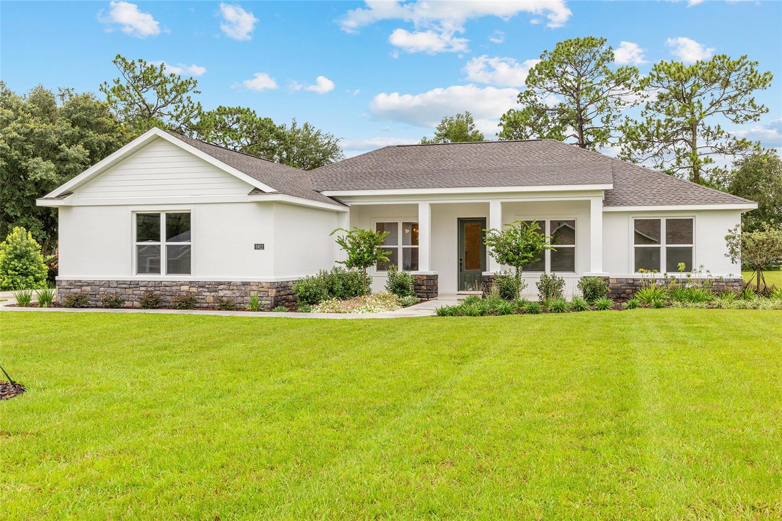 Move in ready! Silver Meadows is a gated community, a haven of privacy and serenity located in the peaceful Northeast side of Marion County. Nothing is better than a Brand-New Home, Floor Plan of home is included in photos! This home features ample space with 3 bedrooms, 2 full bathrooms and an additional room for a sizable study/office/family room.
At the heart of the home, the kitchen features plenty of cabinets for storage, and an open concept island perfect for food prep and entertainment. Look out into your back yard with the window over your sink.
Sip morning coffee or evening cocktails on the expansive 32-foot lanai. This outdoor space could become a future pool oasis!
Back inside, the home features 9’4” plate height with cathedral ceilings in the Kitchen, dining area and great room, creating a sense of spaciousness and luxury. Practical features like a dedicated laundry room with a utility sink will make cleaning a breeze, large closets, and an oversized 2-car garage make this home as functional as it is beautiful.