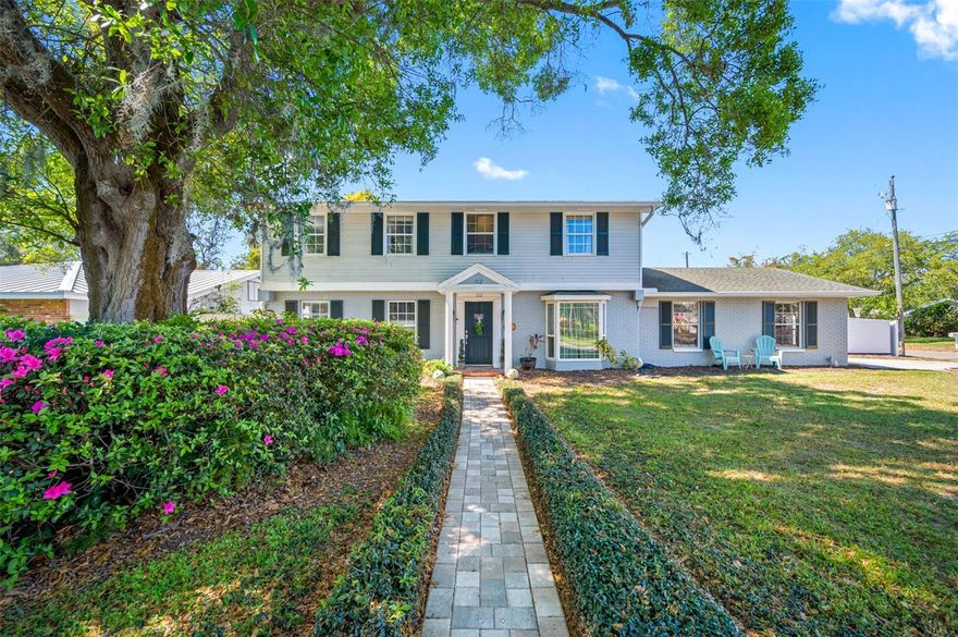 Welcome home to this gorgeous property in central Clearwater, set on a large corner lot with ample parking for your off-roading or water toys. This property offers a great opportunity for ad-value while being move-in ready yet room to add your personal design touch. Step inside the warm inviting entry, featuring four bedrooms, three bathrooms, and additional bonus rooms that can be customized for an office, game room, workshop, and/or studio. The kitchen is a chef's dream, boasting an apron ceramic sink, custom butcher block island, and granite countertops. The solid wood custom cabinetry and open shelving provide ample storage, while the designer backsplash with trim detail adds a touch of elegance. Modern appliances include a newer dishwasher, stainless steel refrigerator, and range with a hood vent. The kitchen also features wood beams in the raised ceiling and a French door that opens to the paved outdoor patio, making it perfect for entertaining. Enjoy the convenience of a BBQ grill positioned right at the kitchen window, featuring reinforced heat-resistant siding. Throughout the home, you'll find beautiful flooring choices, including travertine in the kitchen, cherry wood in the family room, and wood-like vinyl flooring throughout. Abundant natural light fills the spaces, creating a bright and welcoming atmosphere. Upstairs, the primary suite offers double closets and an en-suite bathroom with a walk-in tiled shower and skylight. The secondary bathroom features a newer vanity, tub, and shower combo, along with a deep linen closet. The second, third, and fourth bedrooms are generously sized and include walk-in closets or ample hanging space. Pottery Barn blackout curtains provide maximum comfort and energy efficiency. These rooms share the upstairs bathroom, while a third bathroom on the main floor caters to guests' needs. Outside, you'll discover a large, three-car carport that could be converted into a garage if desired. The cozy patio and fully fenced backyard offer private outdoor spaces to relax and unwind. This home is equipped with modern smart home features, including a smart lock at the back drive entry, a Ring doorbell for added security, and a smart Nest thermostat for convenient temperature control. Centrally located, this solid concrete block Florida home is just 5 miles from #1 rated Clearwater Beach, 2.3 miles to downtown Clearwater, 5.9 miles to Downtown Safety Harbor, 20 miles to St. Pete, and 3.7 miles to Dunedin. It is also conveniently situated approximately 16 miles from Tampa International Airport. Additional features of this property include a whole house water softener system, a new carport roof, a water heater that is approximately six months old, an A/C unit that is approximately eight years old, and updated electric as per the owner's information. Some furniture is optional, allowing for a move-in-ready option. Don't miss out on the chance to make this your new home. Call today to schedule a showing and bring your offers now! (refrigerator in kitchen does not convey, to be switched out with stainless steel one in back room)