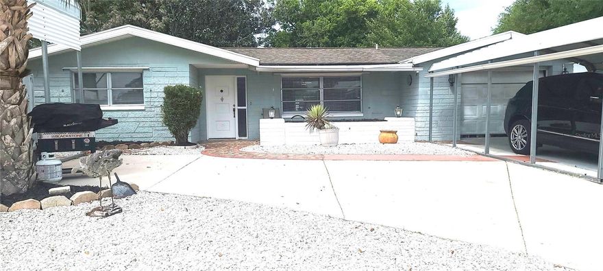 Welcome to your beautifully remodeled oasis! This stunning 2-bedroom, 2-bathroom home perfectly blends modern luxury with cozy, classic charm. Every detail has been thoughtfully updated to provide a move-in-ready experience with high-end finishes. Step into a bright living space featuring durable luxury flooring (neutral tile/luxury vinyl) that flows seamlesslyin the space. The focal point is a gorgeous custom fireplace wall, perfect for cozy evenings. A functional kitchen featuring crisp white wood cabinetry, sleek resin countertops, and a classic subway tile backsplash. The space is rounded out with a suite of newer appliances. Enjoy a Spa-Like Experience and true relaxation in bathrooms boasting exotic veined marble accent walls and floors, cutting-edge Alexa-enabled mirrors, and contemporary designer lighting. Expand your living space on the large, enclosed porch. It features a unique, vintage-style wood-burning vented pot fireplace, offering a nostalgic and warm atmosphere for year-round enjoyment. The property sits on a spacious fenced lot and includes a substantial storage barn in the backyard, perfect for tools, hobbies, or extra equipment. 
Rest easy knowing the "heavy lifting" has already been done:
Roof: Replaced in 2013. Electrical: New panel installed  Plumbing 2008.: Updated with new piping throughout the entire home. 
One Car garage with covered parking and a circular drive for easy in and out. There is RV/Boat covered parking as well. 
The Owner is  motivated. This is a fantastic opportunity to secure a modernized home with significant capital improvements already completed.