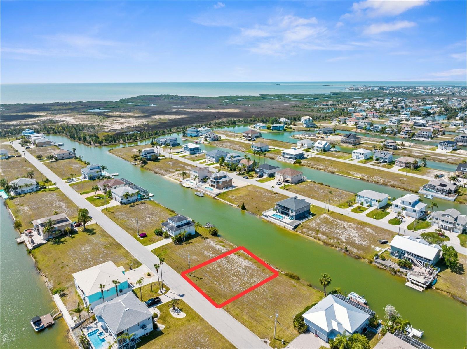 Discover coastal living at its finest with this beautiful 75x100 ft waterfront lot in the desirable, deed-restricted community of Hernando Beach South. Nestled along a quiet canal, this parcel offers serene views, direct access to the Gulf of Mexico via a community boat lift, and a laid-back lifestyle that’s perfect for boating and nature enthusiasts. Zoned R1C for single-family residential use, it’s the perfect blank canvas to build your dream home. The lot is situated in flood zone AE, which may require flood insurance, but also ensures you're right near the water's edge for all your aquatic adventures. Enjoy peace of mind and a well-kept neighborhood thanks to a low HOA fee of just $330/year. The HOA maintains the boat lift and common areas, preserving the charm and order of the community. Public water and sewer connections are available, and the lot is cleared and ready to build. Whether you're planning to retire near the coast, invest in a vacation home, or build your forever residence, this property checks all the boxes.