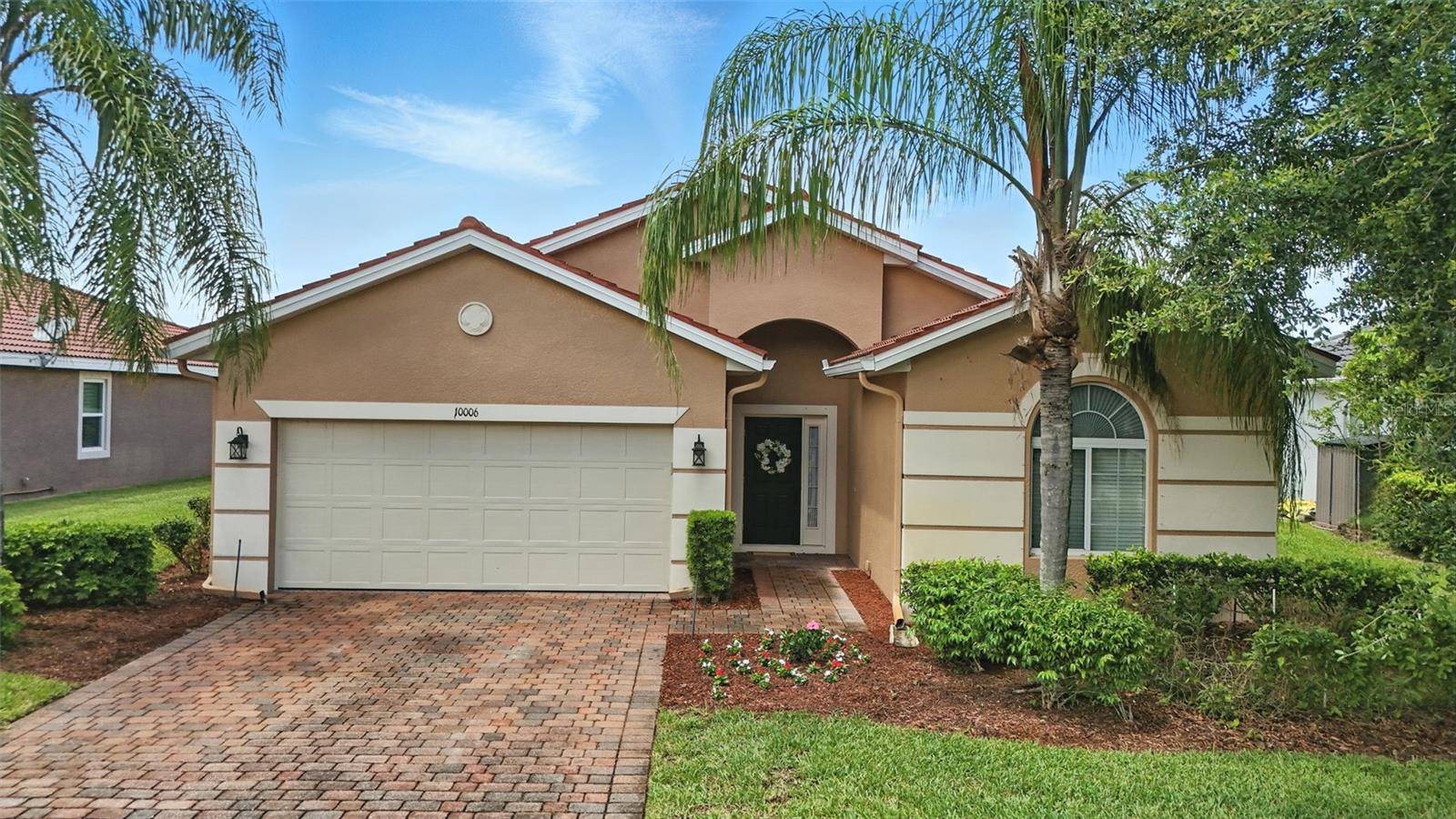 Enjoy serene lakefront living in this beautifully maintained 3-bedroom, 2-bath home located in the highly desirable gated community of The Forum in Fort Myers. With over 1,800 square feet of well-designed living space, this residence offers both comfort and style in one of the area's most convenient and established neighborhoods. From the moment you arrive, the home's curb appeal stands out—featuring a freshly painted exterior, barrel tile roof, decorative stucco accents, and colorful paver driveway. The arched front entry adds a welcoming touch, while mature landscaping enhances the home’s charm. Inside, the open and airy floor plan is perfect for both everyday living and entertaining. The split-bedroom layout provides privacy for guests, and the spacious primary suite overlooks the lake, offering a peaceful retreat complete with two walk-in closets, dual vanities, a soaking tub, and a separate glass-enclosed tile shower. The kitchen is a standout with granite countertops, wood cabinetry, ample pantry storage, and a breakfast bar that seamlessly connects to the main living space. Step outside to the screened-in lanai, where you can enjoy morning coffee or evening sunsets with tranquil lake views. There’s also room to add a pool, making it easy to customize your own private outdoor oasis. Additional features include granite in both bathrooms, a spacious laundry area, and tile flooring in the main living areas. Promenade at The Forum is a gated community known for its quiet streets, well-maintained surroundings, and proximity to the best of Southwest Florida. Enjoy quick access to I-75, SWFL International Airport, Gulf Coast Town Center, and a variety of shopping, dining, and entertainment options. Whether you're looking for a seasonal escape or a full-time residence, this lakefront gem delivers the ideal combination of location, low-maintenance living, and everyday comfort.