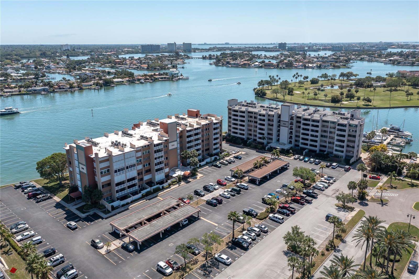 Fully furnished rental available 6 months or more! Discover this spacious 3-bedroom, 3-bath, 1,780 sq ft condo in the coveted Treasure Island Tennis and Yacht Club. This prime corner unit boasts large, sunlit rooms and an airy, open layout all ON ONE LEVEL. It features hurricane shutters for added peace of mind. Perched on the 4th floor, you'll enjoy double balconies with breathtaking western sunset views. The beautifully updated kitchen features granite countertops, a convenient bar, and ample cabinet space. Dual primary suites offer privacy and comfort. The unit is turnkey and move-in ready and **LEASED FURNISHED**, complete with a full-size washer and dryer for your convenience. This well-maintained building includes a **new elevator and a remodeled lobby** Prime Location, Endless Amenities: Just a short stroll to award-winning Treasure Island Beach, where miles of pristine, white sandy shores and an array of dining options await. For outdoor enthusiasts, the nearby Treasure Bay Golf and Tennis recreation facility offers a wealth of activities, including tennis, pickleball, a 9-hole par-3 golf course, footgolf, picnic pavilions with BBQ grills, shuffleboard, volleyball, and more – all for a nominal fee. Are you looking for more? Downtown St. Petersburg is a quick drive away, where you'll find fine dining, art and cultural museums, waterfront parks, music and art festivals, and the vibrant Saturday Morning Market. Experience the best of **Florida living** in this beautiful Treasure Island condo! *LEASE PURCHASE ALSO AVAILABLE