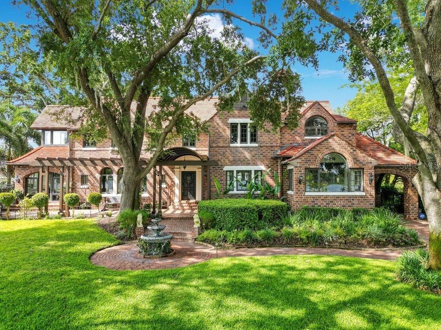 One or more photo(s) has been virtually staged. Back on market due to buyer financing falling through. Home priced at appraised value. The entire experience of this College Park Estate is a revolution and close relationship with nature. Prestigious Ivanhoe Park located on the shores of Lake Ivanhoe with amazing water views and Downtown Orlando Skyline. Exceptional Renovation with a range of spaces inside and out including NEW POOL with Vintage 1936 Brick and nearly 6000 square feet of living area. Private electronic gate entry leads to an oversized garage with electronic charging station, workshop and its own 1-bedroom guest apartment overlooking the garden and pool area. Owners have spared no expense restoring and updating this beautiful home. Custom designer features include Natural Stone Quartzite countertops in Kitchen, and Butcher Block in the Butler Pantry with herb garden on windowsill. "In Common With" designer Light Fixtures in Kitchen and Formal Dining Room along with Restoration Hardware, Serena and Lilly fixtures in Entry and Living Room. Primary Owners Suite Bathroom features a Japanese collection of Bedrosian Tile, Travertine Stone Tops, custom built Drawers and Shelves, Restoration Hardware Medicine Cabinets with mirrors inside and out, Jacuzzi Soaking Tub, Grohe Rain Shower Head and Travertine Stone Fireplace. Kelly Wearstler Sconces, Hunter Douglas Drapes and Blinds add a Touch of Class throughout this amazing space. 3 new HVAC units in 2022. Formal entry with real oak hardwood flooring leads you to an open living area with volume ceilings and refinished wood beams,  plus gas fireplaces adding warmth and comfort to this incredible space. Charming brick flooring in the Florida Sun Room is perfect for morning coffee with relaxing water views. Impressive Family Room overlooking the pool and garden area can also work as a large Den, Office or Library. Formal Dining off Foyer is next to a completely renovated Gourmet Kitchen and Breakfast Nook featuring State of the Art Wolf Appliances, Sub Zero Refrigerator, Two Dishwashers, Gas Cooktop and Range plus Butler Pantry with Wine Cooler and additional refrigerator. TWO primary Owner Suites. Upstairs Owners Retreat with separate sitting area, double sided gas fireplace and Luxury Spa Style Bathroom, Designer Tub and fixtures, Glass shower and Amazing California Closet Dressing Room. Additional Bedrooms all with their own private bathroom. This is one of the few homes that has a true finished basement area with its own separate entrance. Classic Brick exterior and Ludowici Tile Roof plus Copper Gutters are just a few of the quality Custom features you will appreciate when previewing this one of a kind home with walkable friendly neighborhood and one of College Park's most desirable locations.