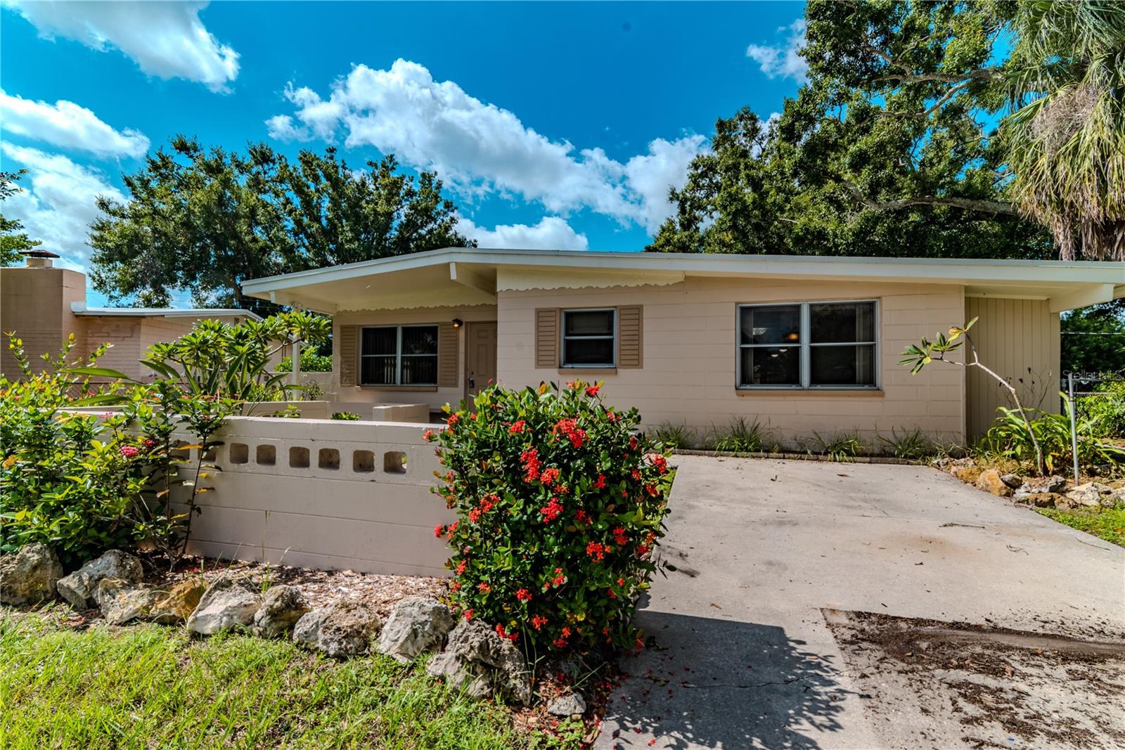 Non-flood zone. Very large, almost 1,500 sq ft home with 3 bedrooms plus a huge, light filled living room/sun room with 14 windows. Home also has a separate family room and dining area. Large fenced in backyard with spacious shed and your very own, little doggy park. Roof approx 2 years old. HVAC and hot water heater approx 2 years old. Ceilings fans in all rooms. Kitchen/dining area and 2 bedrooms have beautiful, Terrazzo floors. New stainless steel appliances along with granite counters and large kitchen island for casual dining. Laundry & storage room can be made into 2nd bathroom/laundry. All windows have secure, hurricane shutters. Just 2 blocks from 54th ave N with great restaurants like Mama G's, Chinelos Taqueria and Donuts/Pies and more. Less than 15 minute drive to the beach. In unincorporated Pinellas County so airbnb is allowed and can be a great income producing property too!