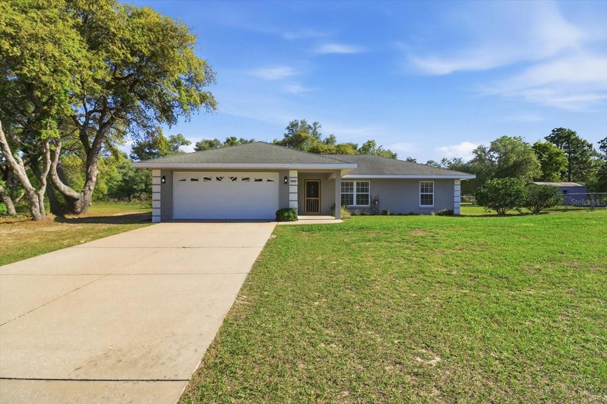 Discover your dream home nestled on 1.15 fully fenced acres in Citrus Springs. This charming property features a thoughtfully designed split floor plan with three bedrooms and two bathrooms, making it perfect for family living. Enjoy modern comfort with a brand new 2022 AC unit that ensures year-round climate control. The spacious yard offers plenty of room for outdoor activities, and there's potential to sell as separate parcels if desired. Inside, you'll find tile and LVP flooring throughout, complemented by updated LED lighting that adds a contemporary touch. A two-car garage provides ample storage and parking options. The seller is offering concessions for a new roof with an acceptable offer, making this an incredible opportunity to invest in your future. Don’t miss your chance to own this versatile property in a desirable location!