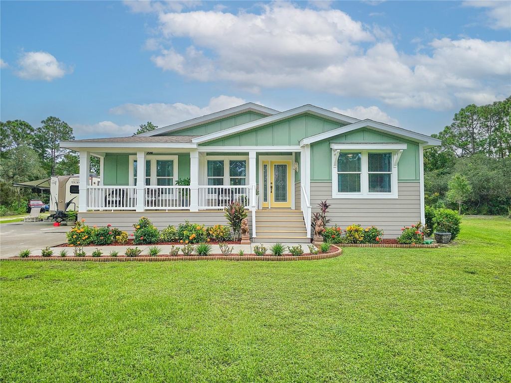 Photo of 875 Volco Road, Edgewater, FL 32141 (MLS # NS1087417)