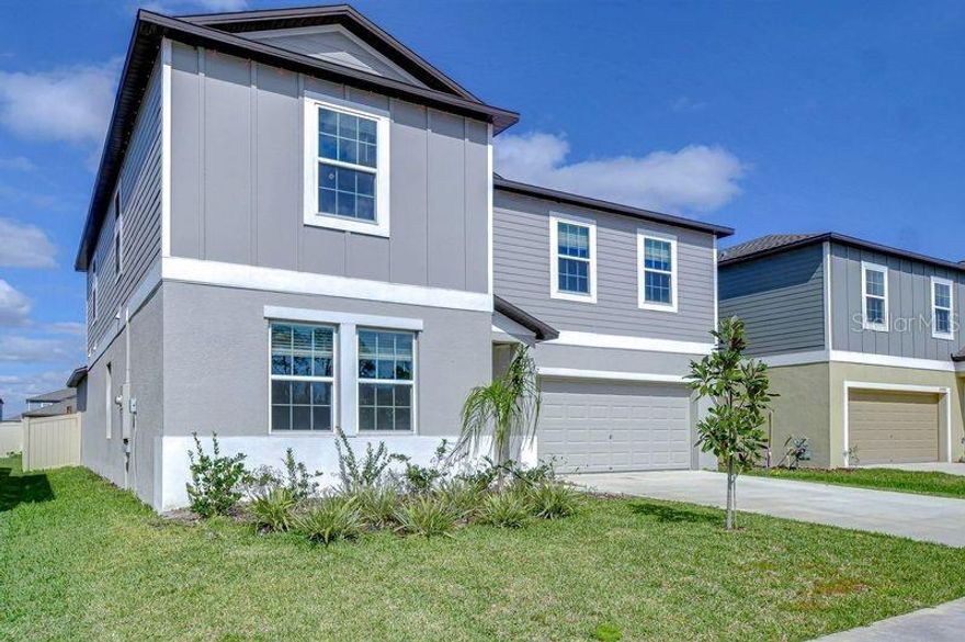 This modern home is a true gem! With 6 spacious bedrooms, 3 bathrooms, a flex room, and a loft, it offers so much space and versatility for any lifestyle. The moment you enter, you’re greeted by luxurious upgrades like the stunning accent wall and the sleek white tile flooring throughout the common areas. The guest room and bathroom are perfect for visitors or could double as an in-law suite. The open-concept kitchen, family room, and dining area create a warm and inviting atmosphere. The custom-built fireplace in the family room adds a touch of elegance with its cedar wood mantle and hearth. The upgraded kitchen features a beautiful, upgraded stone backsplash and wood cabinetry with crown molding. The large primary bedroom is conveniently located on the first floor, which has new luxury vinyl flooring. The primary bedroom has an en-suite bathroom and an impressive walk-in closet. Upstairs, you’ll find a spacious loft area that could be transformed into a game room, media center, or anything else you envision. Plus, four more bedrooms and a 3rd bathroom give plenty of space for family or guests. One bedroom is currently used as an office, making it ideal for remote work. Outside, the expansive backyard features a large custom deck that’s perfect for entertaining or relaxing. The front of the lot faces a cul-de-sac, offering a feeling of relaxing openness. HOA fee includes internet. The yard is fully fenced and has a custom floating deck. New charter school Pinecrest Academy is a pubic charter school is open and ready for. enrollment.  Connerton is known for its amazing community amenities, including a clubhouse with a restaurant, gym, play center, and large pools with amazing water features. Connerton’s second clubhouse and amenity center is underway. Plus, you’ll have easy access to nearby restaurants, schools, shopping, and access to the Veterans Expressway. If you’re looking for a move-in-ready home with stunning upgrades and an unbeatable location, this is the place for you! Come see it for yourself, you’re going to fall in love!