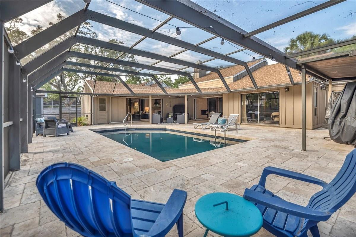 West of the Trail GEM is waiting for you! Nestled in the 42 homesite Buccaneer Bay community of Sarasota -High and dry from last hurricane season! West of the Trail, this a beautifully renovated custom home offers a perfect blend of elegance and comfort. This three-bedroom, three-bathroom residence boasts vaulted ceilings with stunning beams, a stone fireplace, and an open-concept great room layout that seamlessly connects the kitchen, dining area, and family room. The modern kitchen features tall light cabinetry, quartz countertops, a large island, a marble subway tile backsplash, an induction cooktop, breakfast bar, and stainless steel appliances—ideal for both casual meals and entertaining guests. The master suite includes a walk-in closet and a luxurious ensuite bathroom with quartz countertops, a double vanity, and a spacious double shower. Two additional bedrooms and a stylish second bath with a tub and double vanity complete the interior. Step outside to the travertine pool deck, surrounded by mature trees, beautiful lounging area. A full bathroom is located just off the pool area for added convenience. The pool was resurfaced with Pebbletec in 2022, ensuring a high-end finish and durability. A 10x16 outdoor shed with is an ideal workshop, art studio or she-shed offering unique functionality to the backyard space. This home boasts many recent upgrades, including a hurricane-rated garage door, a newer roof (2017), newer AC (2017) and fresh exterior paint in 2025. This home is move-in ready! Located just minutes from Siesta Key Beach, and downtown Sarasota, this hidden gem provides both tranquility and convenience.
WOW**Preferred lender offering 1 % of loan amount towards buyer's closing costs and prepaids with full price offer!**