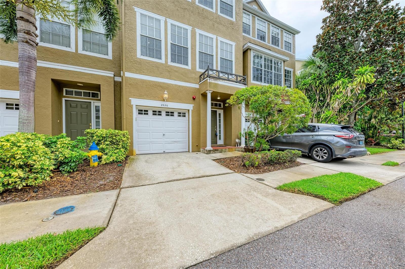 Introducing the highly sought-after Bayshore Pointe Townhomes – a true gem! Prepare to be captivated by this freshly renovated and upgraded 3-bedroom, 2 & 1/2-bath townhouse boasting an attached garage in an exclusive gated community. Located in close proximity to MacDill Air Force Base and downtown Tampa, this stunning home is ready for immediate occupancy. From the moment you step through the front door, you'll be greeted by stylish architecture, modern ceiling/light fixtures, and exquisite bamboo wood flooring throughout. The kitchen is a culinary paradise, featuring wood cabinets, granite countertops, a breakfast bar, and top-of-the-line stainless steel appliances, including a refrigerator, built-in microwave, dishwasher, and stove. For your convenience, a washer and dryer are also included in the home. The living room offers a breathtaking view with double French doors leading to a spacious covered balcony overlooking a picturesque pond, fountain, and pool. Prepare to be pampered in the master suite, which showcases a contemporary upscale bathroom with dual vanities and modern shower tiles and fixtures. Unwind and relax in the bonus room on the first floor, complete with an attached screened lanai. This retreat provides easy access to the serene pond, inviting pool, volleyball court, and other recreational areas, ensuring endless opportunities for leisure and enjoyment. As a special highlight, the community boasts its very own pier, granting private access to the beautiful Tampa Bay. Take in mesmerizing sunsets as you stroll along the famous Bayshore Boulevard, conveniently located within walking distance. With its exceptional features and prime location, this home truly stands head and shoulders above the rest. Don't miss the opportunity to call this gem your own!